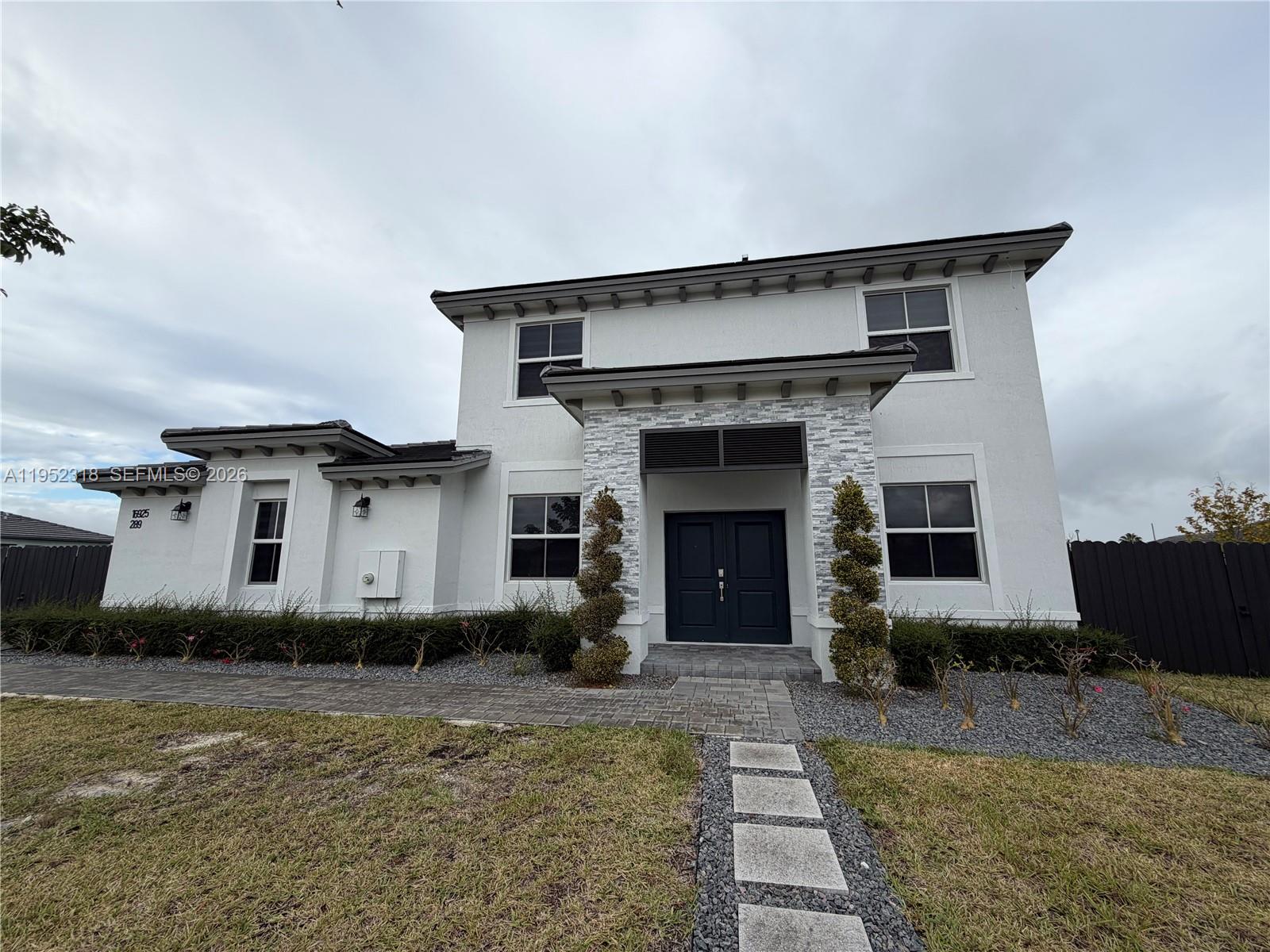 This spacious home features an open-concept layout with the living room, family room, dining area, and large kitchen seamlessly connected. Sliding glass doors open to a covered patio, ideal for indoor-outdoor living. A second floor private hallway leads to each bedrooms with generous closet space.