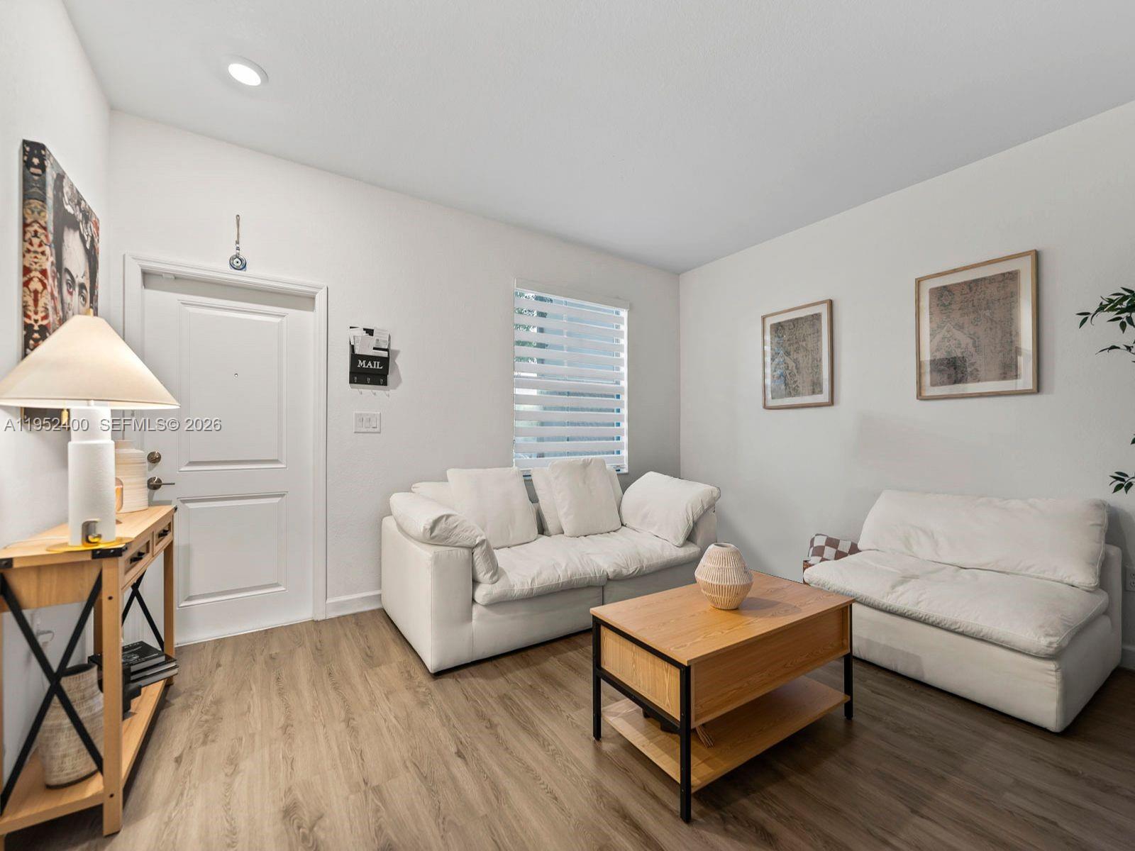 The most updated townhouse currently available in Sienna Reserve South, offering unmatched upgrades within this beautiful Homestead community. This 3 bedroom, 2.5 bathroom townhouse offers a perfect blend of style and comfort. Step inside to find sleek laminate floors throughout, all impact windows/doors, elegant glass closet doors, zebra blinds, Aromadd HVAC diffuser that add a designer touch. The home also includes a convenient in-unit washer/dryer and a covered, tiled terrace which makes it an inviting space to relax. Living room, dining room, master bedroom and terrace furniture can be included in the sale at no additional cost. The low HOA fee includes access to the clubhouse, community pool, children's playground, and exercise room. This is home is tastefully designed for relaxation and everyday living.