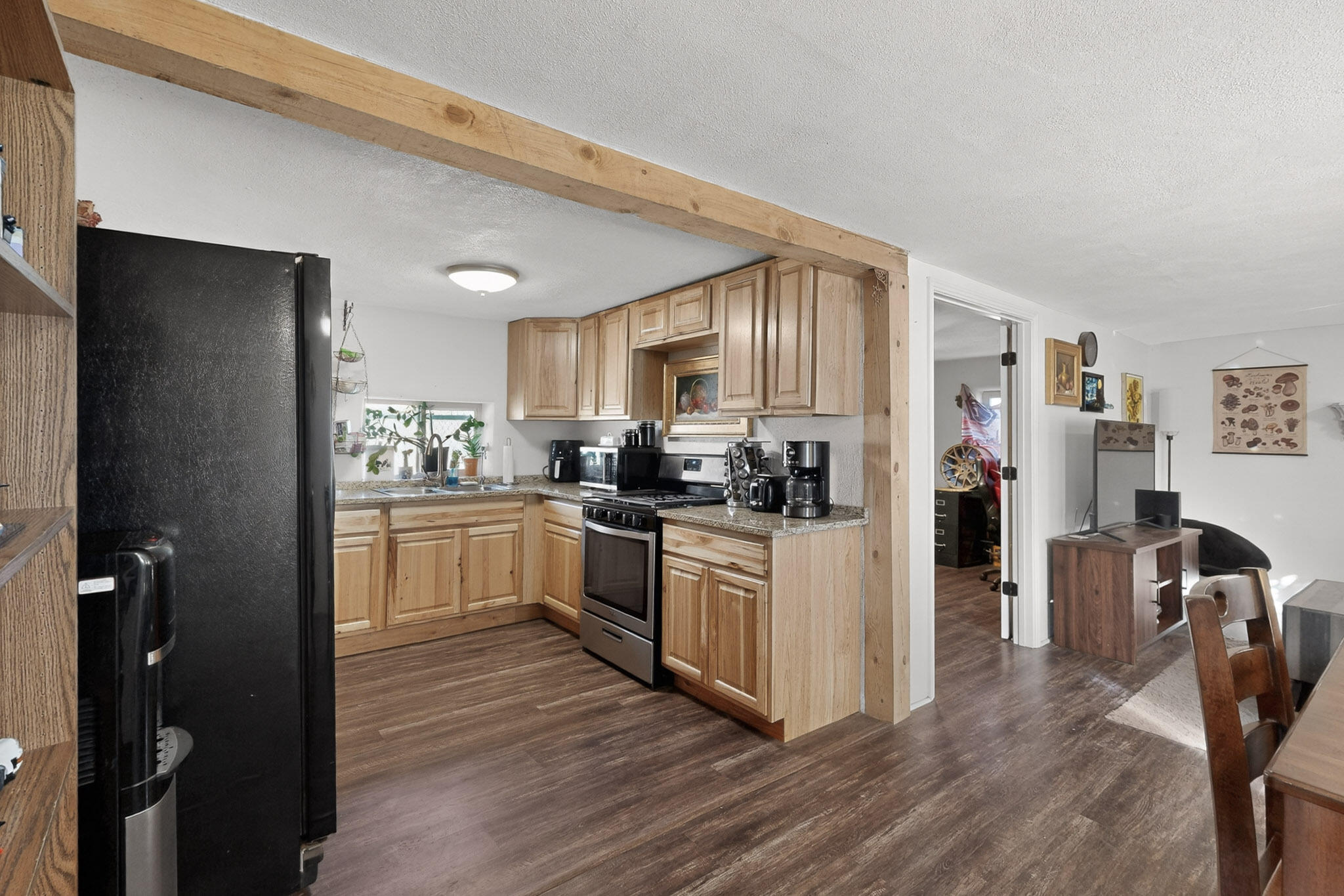Cutest kitchen on the planet in a perfect adobe starter home in the Sawmill district.  Property has upgraded electric service, split system heating and cooling, and built-in water filtration.  All this in a comfortable ambient setting right behind the Sawmill Market.  Bring all offers.