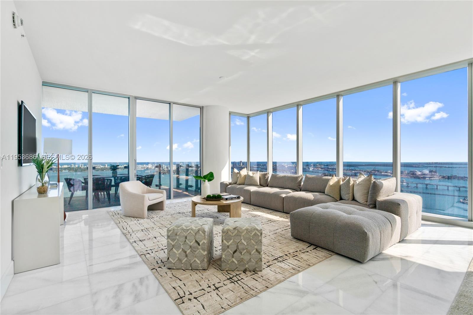 This spectacular residence offers the epitome of modern living with 4 spacious bedrooms, a family room, and 6 elegant baths, all adorned with impeccable finishes. Revel in unobstructed water views and a breathtaking city skyline from your floor-to-ceiling windows. Convenience is key, with a separate laundry room and extra storage ensuring ample space for all your needs. Don't miss the chance to call this stunning property home – where impeccable design meets unparalleled vistas at Missoni Baia.Parking spaces unit is 522 & 523.