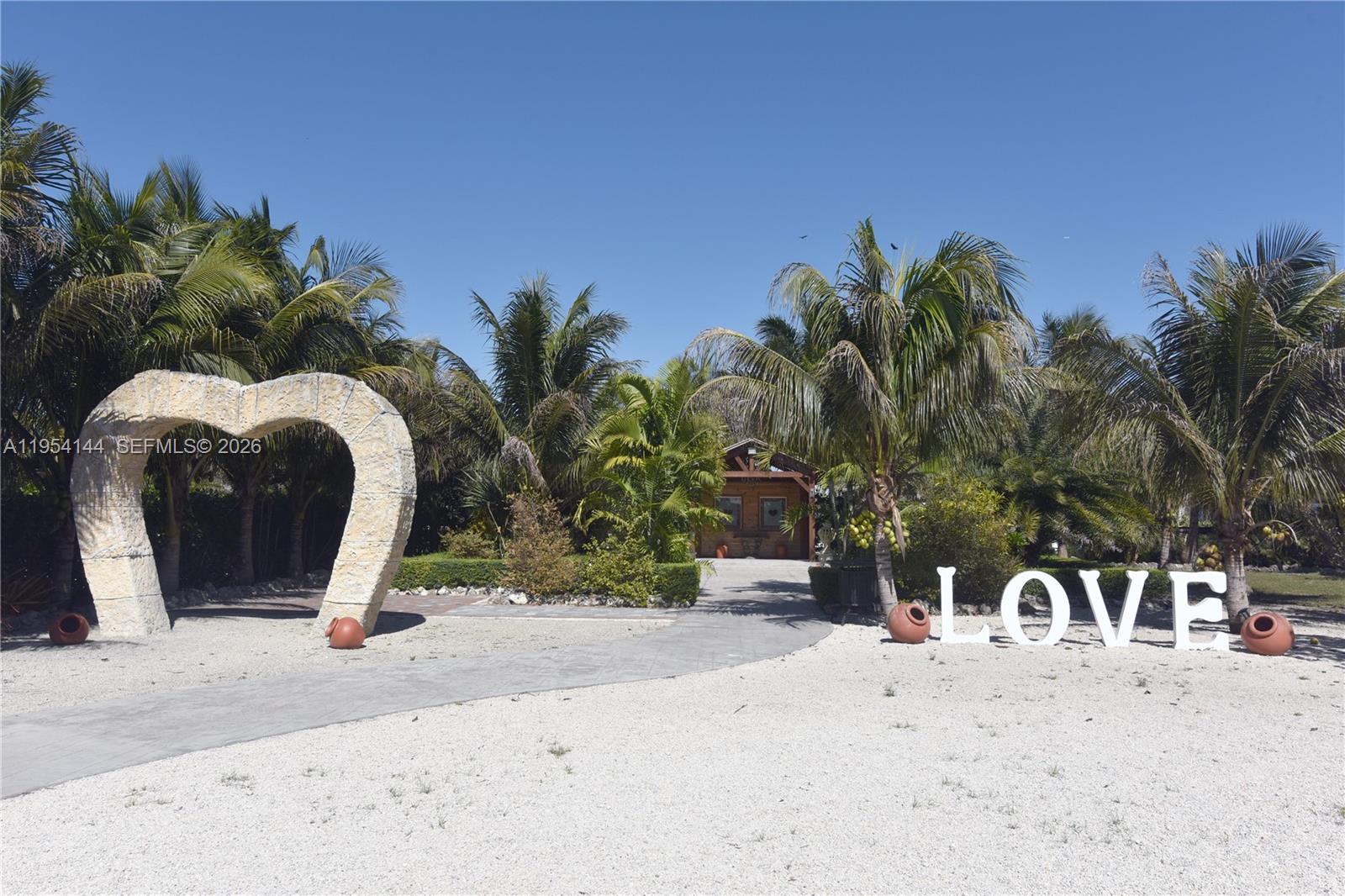 Folios 30-5826-000-0011 and 30-5826-000-0074 are being sold together for a combined list price of $2,995,000. Spanning just over 6 acres, this expansive property offers exceptional potential for an income-producing business, including use as private event venue, retreat space, or agricultural enterprise. The property features a main residence, numerous mature fruit trees, a cascading water feature with koi pond, and a large pavilion ideal for events, complete with a built-in bar and storage room. With ample open space and unique amenities, this property presents endless opportunities for commercial or mixed-use vision. A rare opportunity and a must-see.