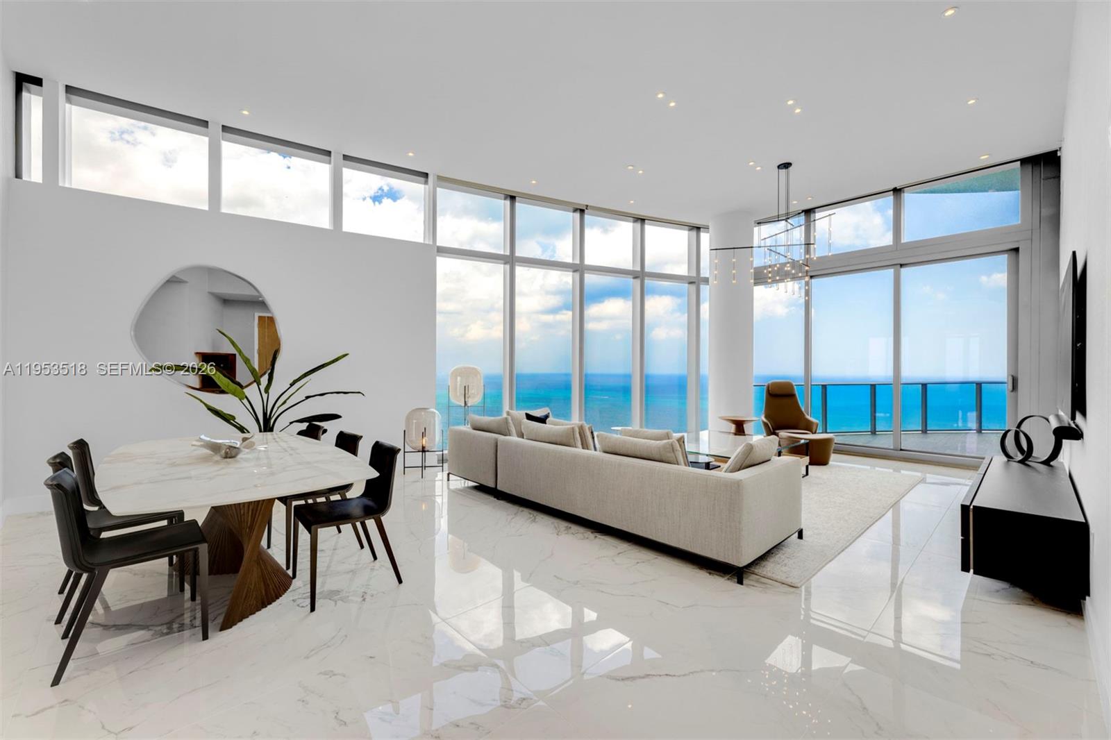 Sky Villa 4701 at Ritz Carlton Residences Sunny Isles redefines extraordinary. From the moment you step off the private elevator into this one-of-a-kind space in the sky, it’s easy to see just how far this residence has separated itself from anything else on the South Florida market. 13 ft. volume ceilings, floor-to-ceiling windows, panoramic ocean views and magnificent sunsets, two terraces, over 3,000 sq. ft. with 3 Bedrooms, 4.5 Bathrooms plus a Den. Finished with Marble Floors, and perched near the top of the building, this is the tallest residence available at the Ritz. Italian Gourmet Kitchen with Gaggenau appliances, Wine Cooler, and built-in Cappuccino maker, opens up to the oceanfront Dining Area and Living Room. The Ritz Carlton's amenity package includes: Private Elevator, 24hr Concierge, valet, oceanfront spa and fitness center, beach & pool service, two private pools, & on-site restaurant.