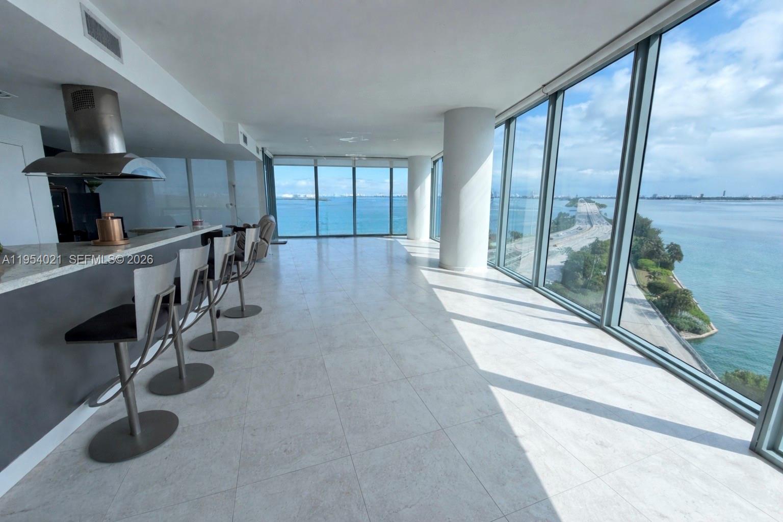 Spacious 1,870 sq ft corner residence in one of the most desirable lines in the building, offering unobstructed water views from every room with stunning views of the bay and Miami Beach. Floor-to-ceiling windows fill the space with natural light, creating a bright, open layout ideal for both living and entertaining. This sought-after floor plan features 2 bedrooms with en-suite baths plus a guest bath, and an expansive living and dining area with excellent flow throughout. Priced to sell and one of the best values in the line, this residence presents a great opportunity to customize and create your ideal waterfront home. Includes 2 assigned garage spaces, 1 valet space, and a private storage unit. Full-service building with resort-style amenities.Photos are of the actual unit. Furniture has been digitally removed to better illustrate the space and layout.