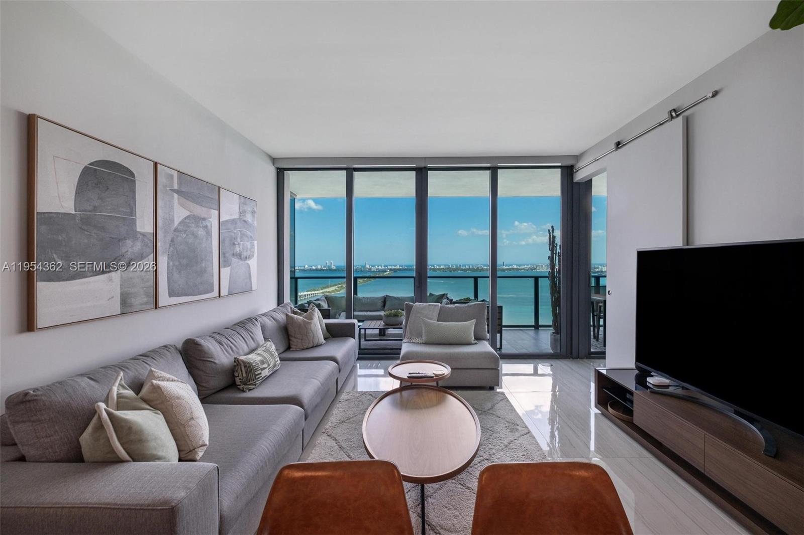 Experience the height of luxury on the 36th floor of Edgewater's sophisticated One Paraiso. This exquisitely finished 2-bedroom, 2-bath residence showcases breathtaking panoramic views of Biscayne Bay and the Miami skyline through floor-to-ceiling impact glass. Arrive via your private elevator foyer into a sanctuary featuring polished marble floors throughout and an open chef’s kitchen equipped with premium stainless appliances. One Paraiso offers world-class resort-style amenities, including multiple pools, a spa with steam room, tennis courts, a state-of-the-art fitness center, party rooms, valet, and a 24-hour attended lobby. Ideally situated for the modern urbanite, this pet-friendly building is located directly across from Whole Foods and steps from the vibrant dining and boutiques of Wynwood, the Design District, and Midtown. Enjoy the ultimate Miami lifestyle just minutes from pristine beaches and world-class entertainment.