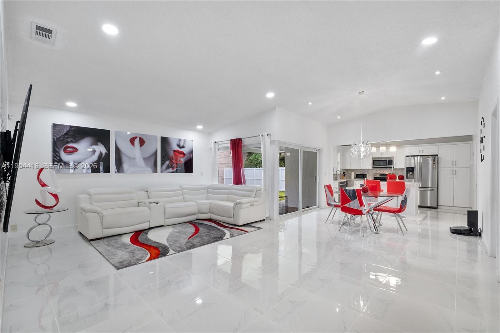 Multigenerational home offering 5 bedrooms and 4 bathrooms in a 1,871 sqft living space. Upgrades in 2022 include modern kitchen and bathrooms, plumbing, HVAC, and water heater. Roof 2021. Open-concept, spacious living area with a dining room that flows seamlessly into the kitchen. Large walk-in closets and extra linen closets. The garage has been converted into a private efficiency, perfect for extended family, guests, or rental use. Outdoor living is enhanced by a modern terrace with an aluminum awning, a contemporary 2023 in-ground pool with travertine surrounding, and a fully fenced yard offering privacy and security. EXTRA: ADU (RV) currently parked in the patio with a private entrance, capable of generating additional income. The property is conveniently located near schools and shopping centers, with easy access to the Florida Turnpike Exit 6. A rare opportunity to own a flexible, multi-use property in a prime Homestead location.