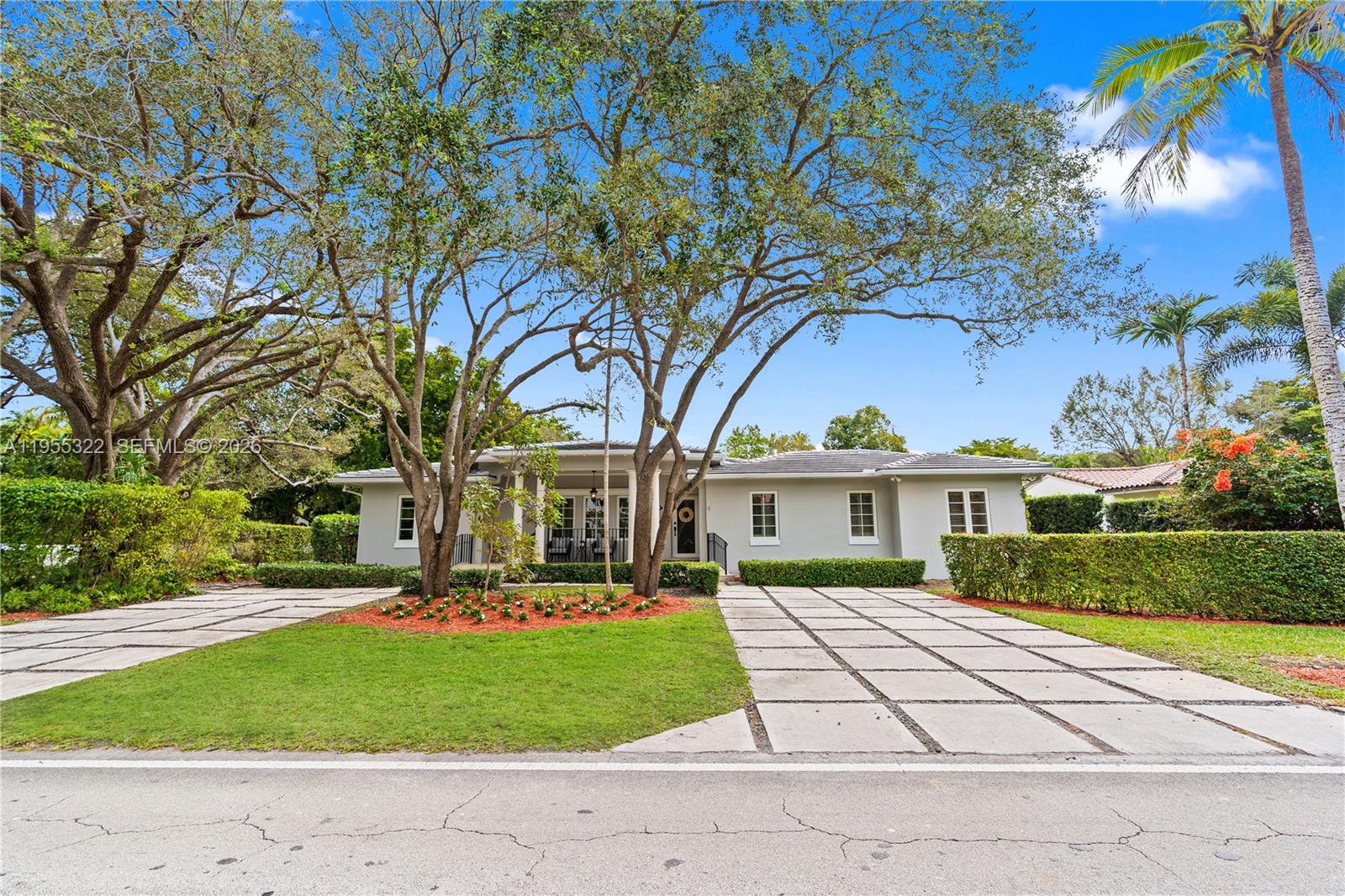 Classic Coral Gables elegance meets modern updates in this refined 4BD/3BA residence, featuring new impact windows & doors, a 3-year-old roof, rich wood floors, custom crown moldings with beautifully detailed wood trim throughout every window & doorway. Gracious living spaces include a formal living room, formal dining room, sun-filled family room, a kitchen w/ breakfast area—all overlooking a private terrace ideal for outdoor dining & entertaining. The desirable split-bedroom floor plan offers privacy and effortless flow, anchored by a grand primary suite with 2 oversized walk-in closets + 3 bedrooms & 2 baths. Situated on a corner lot with a 2-car garage, the home enjoys tranquil views of a brand-new park directly across the street, creating a serene and picturesque setting. Ideally located near UM, Riviera Country Club & Golf Course, The Biltmore Hotel, Merrick Park, dining & shops.  A rare opportunity to own a timeless, move-in-ready home in one of Coral Gables’ most coveted neighborhoods.
