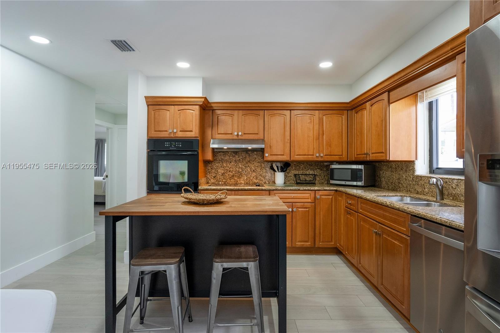 Modern kitchen with designer features at 510 3rd Ave - Home in Dania Beach
