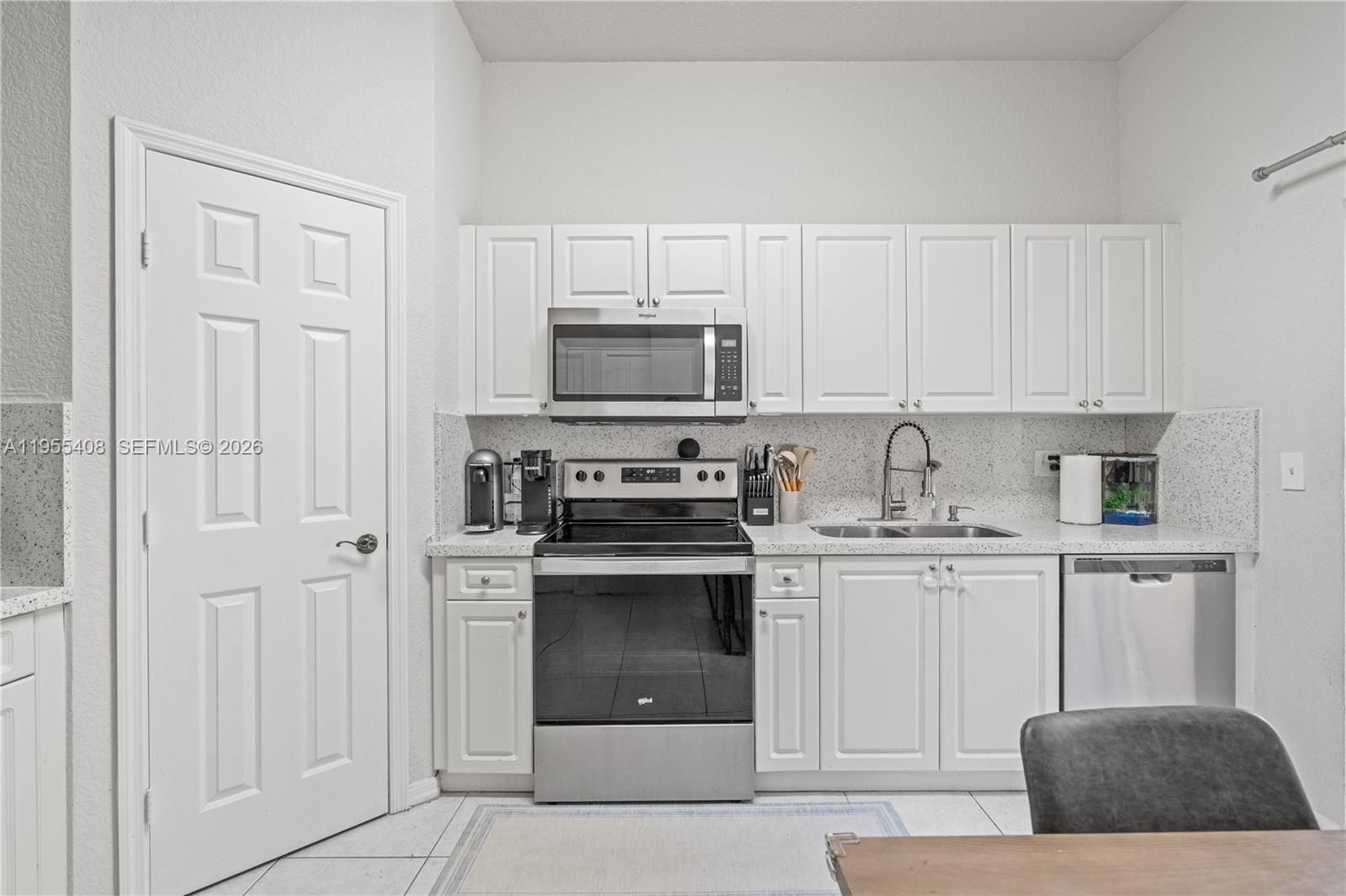 Remodeled 2BD 2.5BA condo in the highly desirable Arbor Park community within Keys Gate Golf and Tennis Country Club, offering easy low maintenance living in a gated, family friendly neighborhood with lush green views.Updated kitchen with quartz countertops, 2 year old appliances, and a spacious pantry. Tile throughout home, recessed lighting, and abundant natural light. Primary suite features dual sinks, a stand alone tub and shower, and custom closet built ins. Second bedroom is a junior suite with its own bathroom and a private balcony overlooking the garden.Includes 1 car garage plus 2 driveway spaces, separate laundry room, private fenced patio, covered front porch, and AC coils approximately 1 year old.Located directly in front of the community pool and playground just a one minute walk, making it ideal for families and everyday convenience.HOA is $690 per month and includes roof coverage, exterior insurance plus cable and internet, which are usually separate monthly bills. It also includes 24 hour gated security, a resort style pool, playground, tennis courts, and full common area maintenance.Minutes from A rated public and charter schools, BJ’s, Target, Homestead Baptist Hospital, and just 30 minutes from the Florida Keys.FHA and Conventional welcome buy with as little as 3% down. Buyer may qualify for down payment assistance up to $14,550.