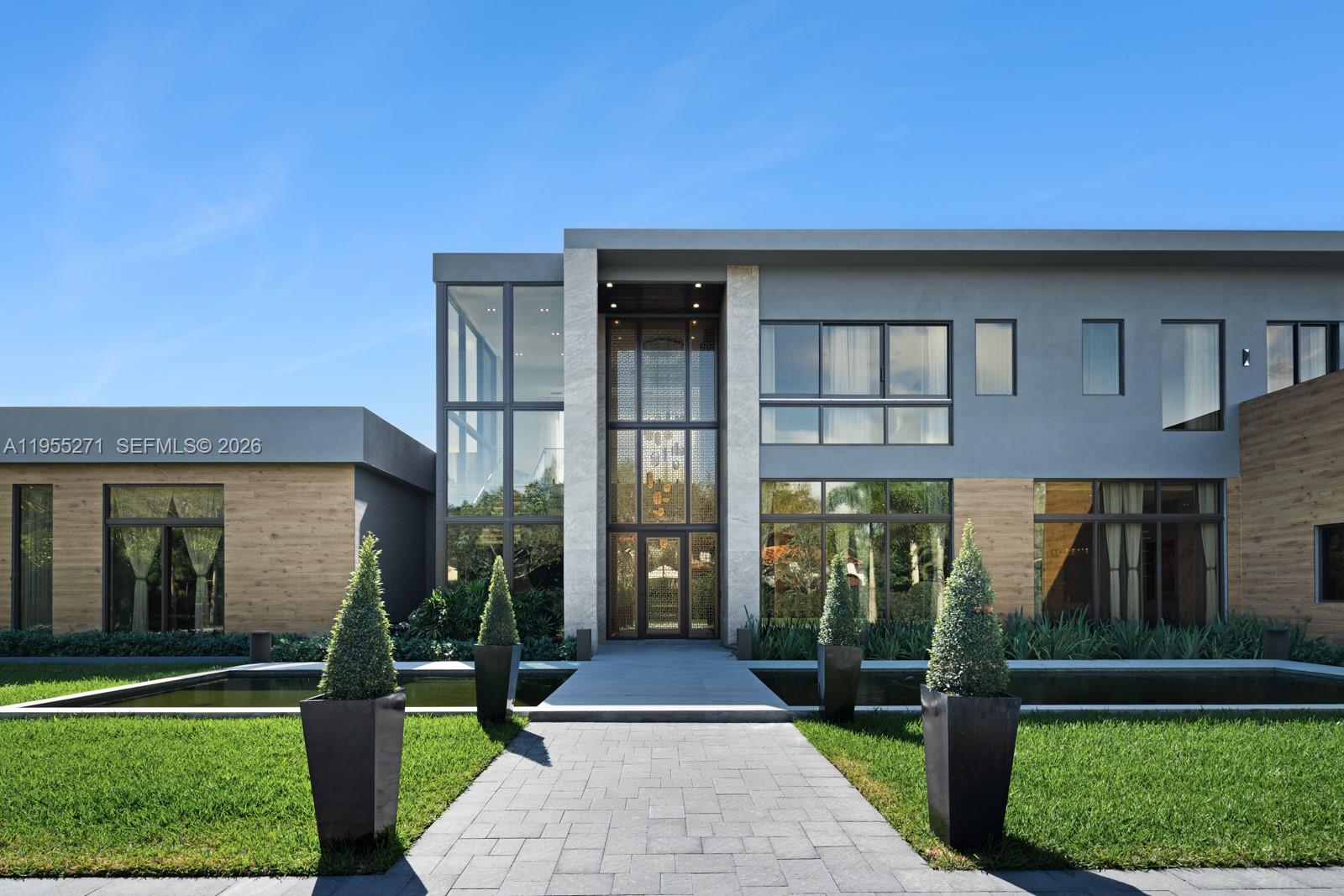 This unparalleled turnkey masterpiece in the heart of Pinecrest redefines luxury living. Boasting a pristine pool, expansive backyard, and a state-of-the-art open kitchen, it’s designed for ultimate comfort and entertainment. A private gym, custom library, and an immersive movie theater elevate this home to a whole new level. Every detail exudes sophistication—move in now and experience the pinnacle of refined living.