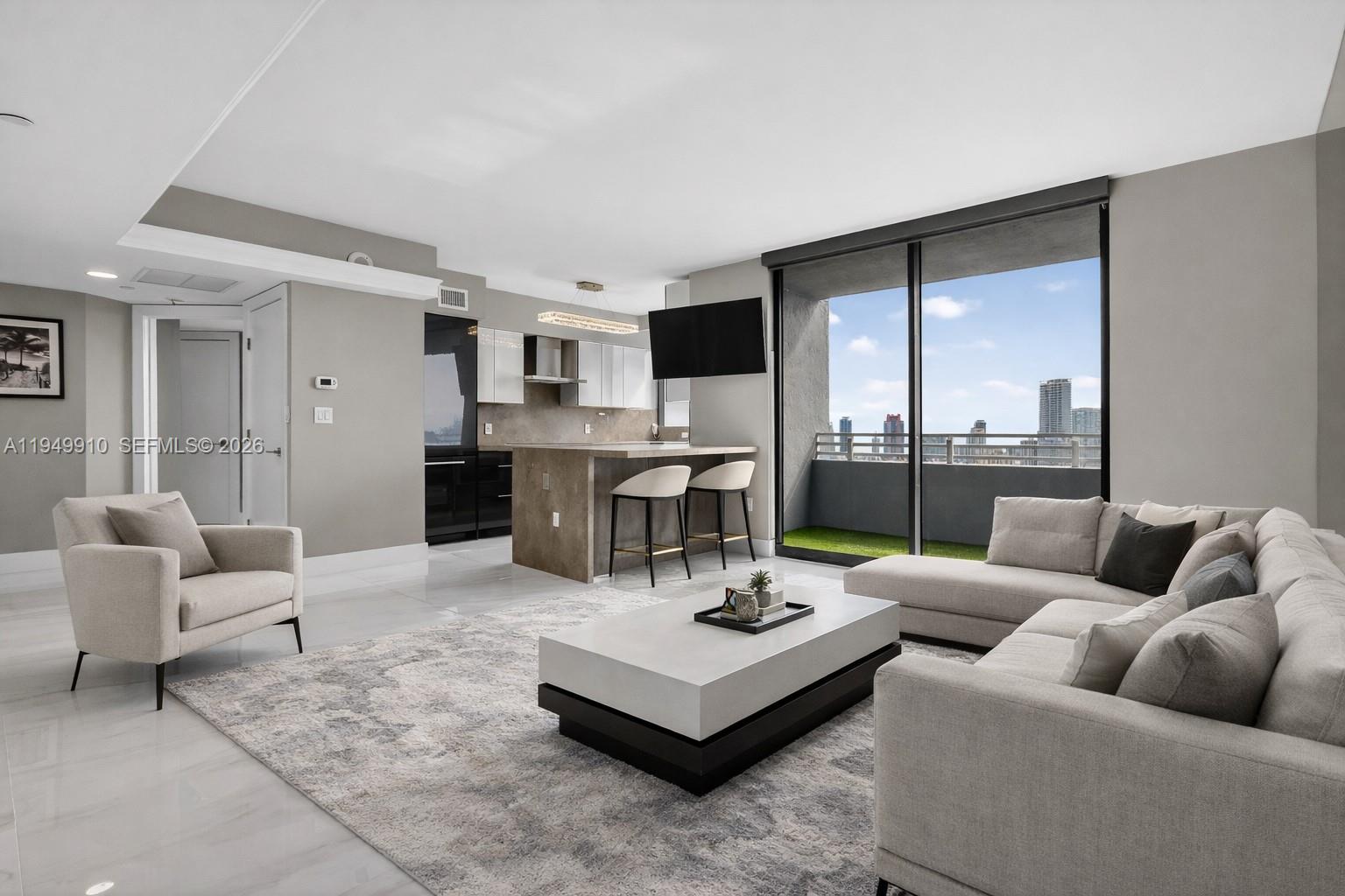 Live the South Beach dream life in this updated modern residence set within The Waverly, an exquisite high-rise that embodies the iconic Miami lifestyle. Enjoy stunning panoramic views of the bay and city skyline from this beautifully designed 2-bedroom, 2-bath home offering luxury living at its finest. The open-concept layout is highlighted by a sleek, modern kitchen with stylish cabinetry and top-of-the-line Bosch appliances, creating the perfect space for both everyday living and entertaining. Upscale finishes and fixtures are thoughtfully integrated throughout, giving the interior a refined yet relaxed feel.The spacious primary bedroom features a walk-in closet with custom cabinetry and dimming lights, along with a window framing views of Star Island and the world’s largest cruise ship port. The residence also includes a fully updated, custom-built in-unit washer and dryer for added convenience.The Waverly offers state-of-the-art amenities including 24-hour security, resort-style pools, tennis court, spa, yoga room, party room, and entertainment room. Ideally located within walking distance to Lincoln Road, Sunset Harbor, and Flamingo Park, and just moments from top restaurants, Whole Foods, and Trader Joe’s, this home truly stands out as a gem on Miami Beach—offering the best of South Beach living.