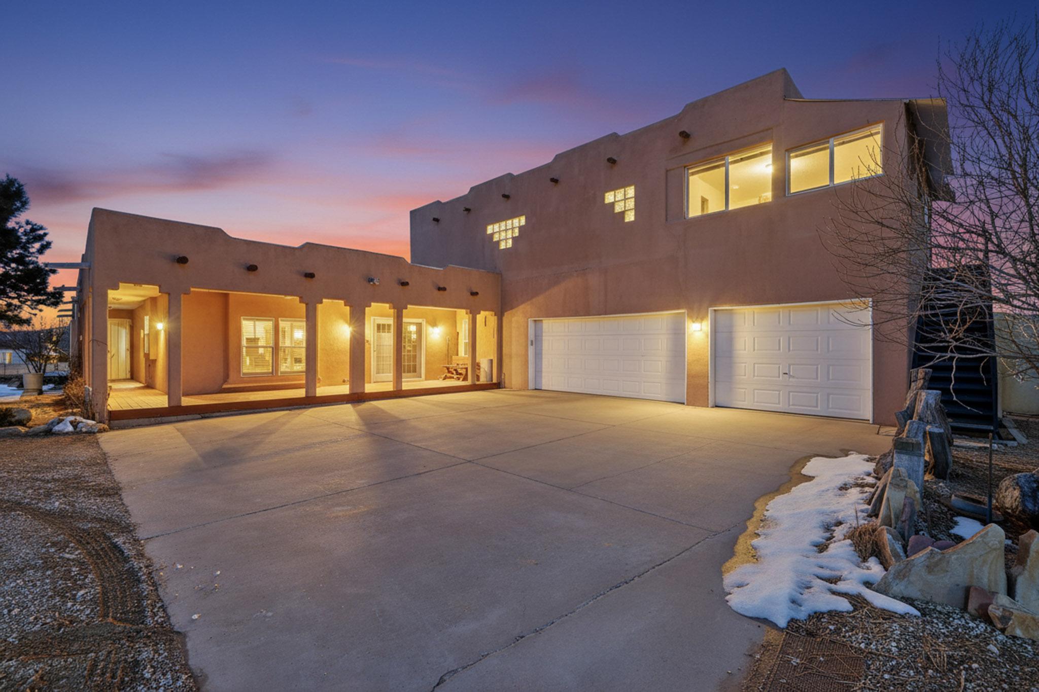 Welcome to 4 Glitter Gulch Way in Edgewood! This stunning custom home offers 2,993 sq. ft. of living space, including 1,286 sq. ft. of heated site-built area, plus an oversized custom 3-car finished garage with extra storage. Enjoy breathtaking views from the wrap-around deck and an open, flowing floorplan filled with natural light. Featuring 3 bedrooms, an office with built-ins, 2 living areas, and a huge game room above the garage, this home is perfect for both relaxation and entertaining. The property sits on 2.5 acres with a fully equipped horse barn, complete with utilities, 4 stalls, tack room, and ample storage.