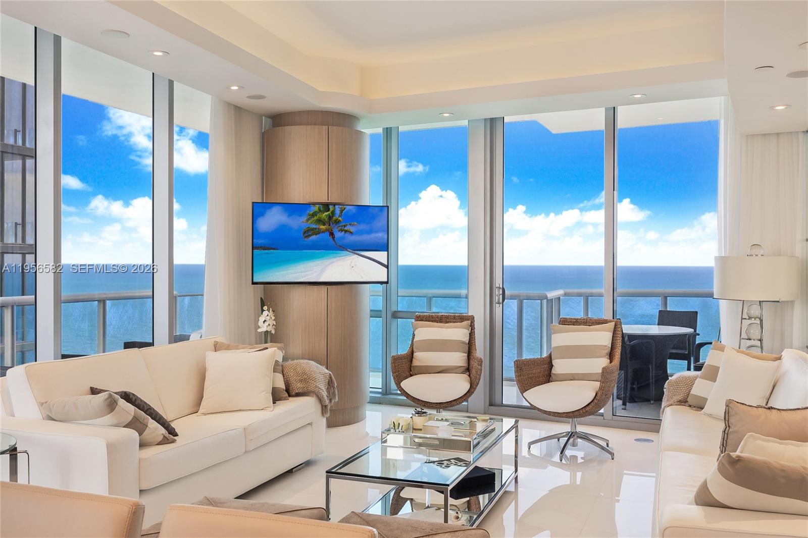 Stunning corner residence at Jade Ocean, the iconic Sunny Isles Beach tower designed by renowned architect Carlos Ott. This sophisticated 3-bedroom, 3.5-bath home spans 1,956 square feet and offers sweeping, unobstructed views of the Atlantic Ocean, Intracoastal, and city skyline.The residence has been featured in DECOR Magazine and professionally curated by Infinity Design’s Ronny Constansi, showcasing refined interiors and thoughtful detailing throughout. Highlights include a private elevator entry, floor-to-ceiling impact glass, marble flooring, smart home technology, surround sound, automated window treatments, and premium appliances. Offered furnished or unfurnished.Jade Ocean delivers a true five-star lifestyle with resort-style amenities, including dual infinity-edge pools, a state-of-the-art fitness center, full-service spa with relaxation lounge, private cinema, children’s playroom, 24-hour concierge, valet services, and an exclusive beach club. An exceptional opportunity to experience modern coastal luxury at its finest.