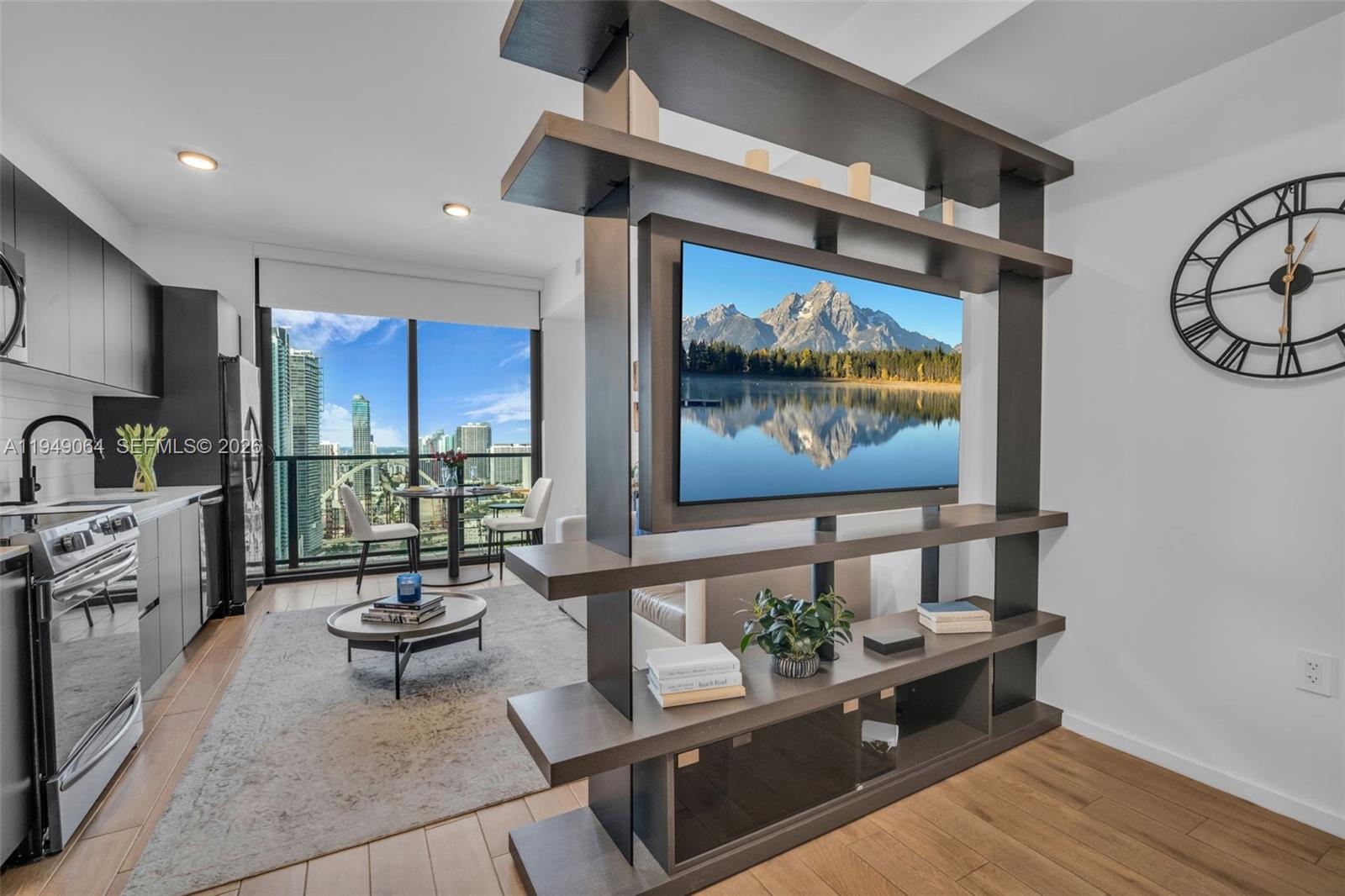 High-floor, fully furnished studio at The Elser Hotel & Residences showcasing panoramic skyline and Biscayne Bay views. Sleek open layout with wood-look porcelain flooring, floor-to-ceiling glass, and a private balcony. Turnkey and rental-ready with daily rentals permitted and no minimum lease—ideal for income-producing ownership or flexible luxury living. Full-service condo-hotel offering a 24/7 front desk, resort-style amenities, and a prime Downtown Miami location near Miami Worldcenter, dining, and entertainment.