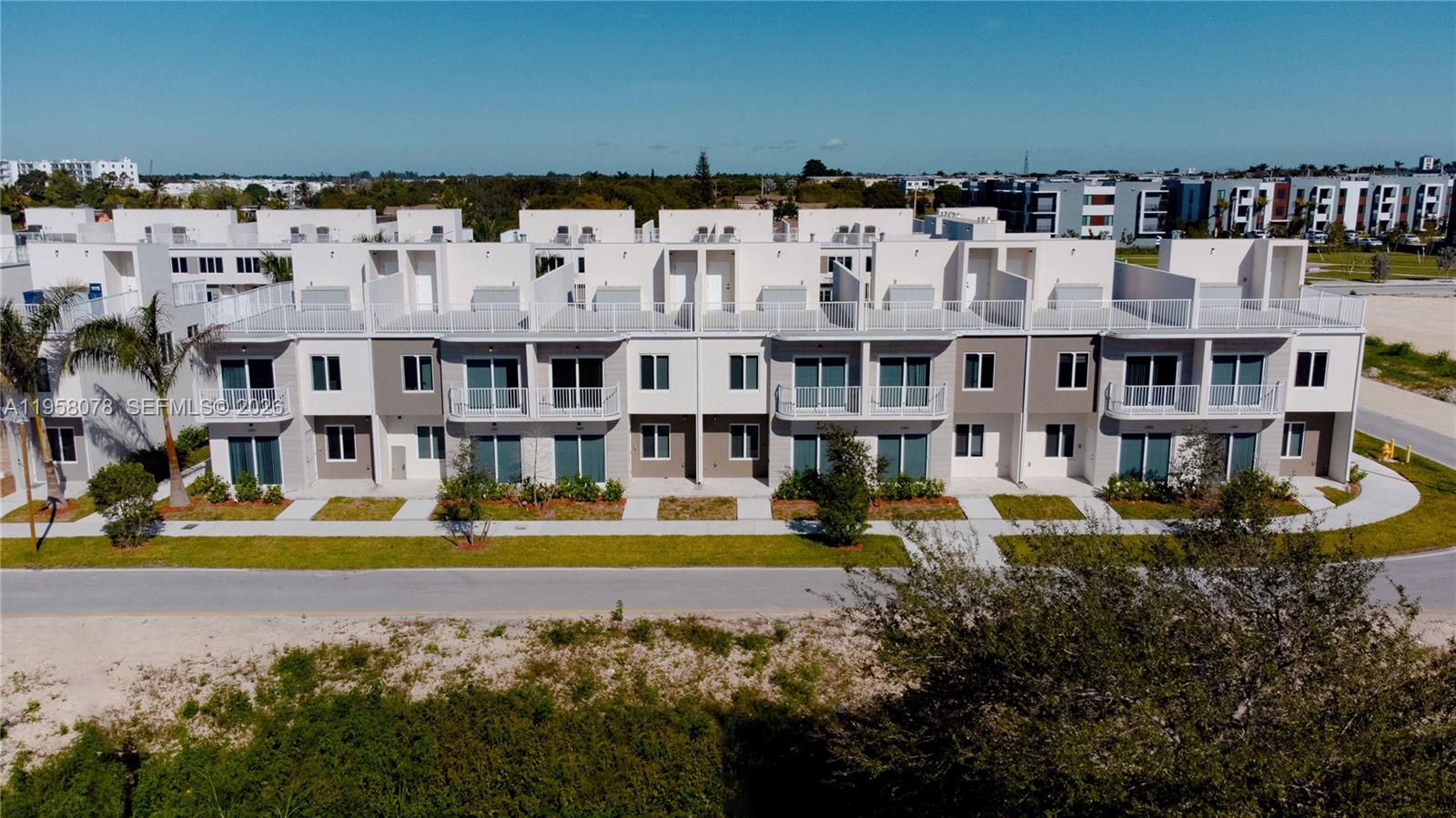 Grace Homes Townhouses Move-in-Ready modern Open Rooftop Townhouse with private balcony in the heart of South Miami-Dade. Conveniently located near US-1 and Florida’s Turnpike (Exit 6). Grace Homes is situated in the rapidly developing Naranja neighborhood with easy access to shopping and charter school options. This residence is part of a boutique community of only 32 homes. Offering 4 bedrooms and 4 full bathrooms, including a ground-level guest suite, the thoughtfully designed layout provides flexibility for families, guests, or home office needs. The home features a modern open kitchen, contemporary finishes, and porcelain tile flooring throughout—no carpet—creating a clean, sleek, and low-maintenance living space. Enjoy two parking spaces and buyer incentives including closing cost credits and a low interest rate when using the preferred lender and title company. No pet restrictions. Easy to show. No Flood requirement