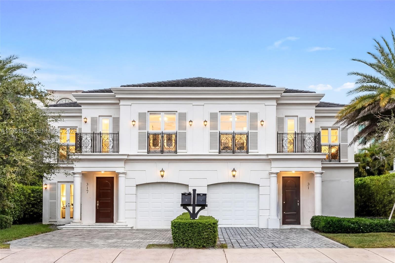 Located in the heart of Coral Gables, this stunning 2-story luxury townhouse in Villa Blanc offers 2,560 SF under air with 3 bedrooms, 3 full bathrooms, and 1 half bath, just steps from The Plaza, Miracle Mile, and Giralda’s premier dining and shopping. The elegant interior showcases high-volume ceilings, marble floors, wide plank baseboards, recessed lighting, French doors and windows, and an ample entry foyer with a solid wood door. The open-concept great room seamlessly connects living and dining spaces to a gourmet kitchen featuring white quartz countertops, a center island with seating, and premium Thermador appliances. Upstairs offers three bedrooms, a den or office, wood-style tile flooring, and a full laundry room. Outdoors, enjoy a private chlorinated lap pool with Venetian Grey marble deck, ironwork balconies, and a 1-car garage with storm-rated door. The expansive primary suite features two walk-in closets, spa-style bath with frameless marble shower, Roman tub, dual vanities, and private balconies overlooking the pool and entrance. Additional features include dual AC units, ADT security system, and hybrid electric water heater. Photos shown are of the next door unit with an identical floor plan. Actual light fixtures and finishes may vary.