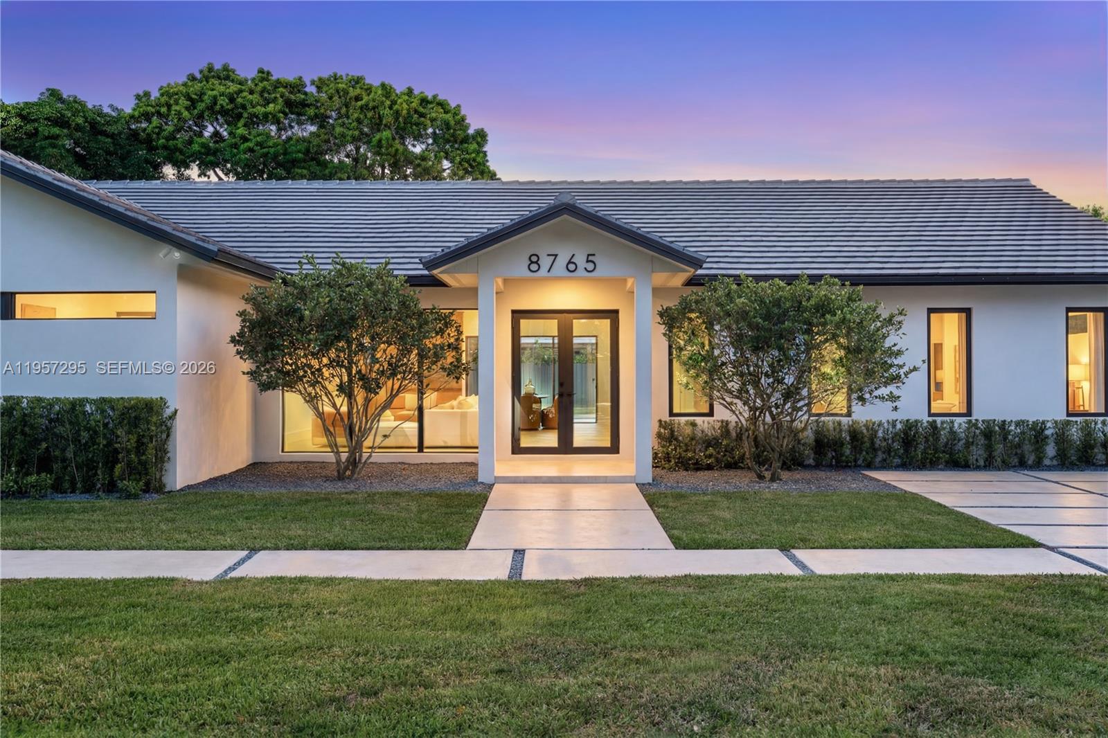 Be the first to live in this recently completed, luxurious Miami home. Crafted by the expertise of leading interior designers; This 5 bedroom / 4 bathroom home encompasses 2825 total sq.ft. on a 15,600 sq.ft. lot. Upon entering, you are greeted with a spacious open floor-plan featuring 10-ft ceilings, white-oak hardwood flooring, and a European kitchen with custom cabinetry & natural granite countertops. The master suite offers a large walk-in closet and spa-inspired bathroom with dual showers and soaking tub. All bathrooms feature custom floating vanities with marble countertops, and Grohe / Hansgrohe shower trims and fixtures. This beautiful Miami home also includes controllable / dimmable lighting throughout, dual A/C & climate control, dual tankless water heaters, 2-car garage, sprinkler systems, and 8 ft tall impact-resistant windows and doors. Additionally, this home has brand new plumbing, HVAC, and electrical systems. Outside, the lush front / back yards feature a large 14 car driveway, and a saltwater-chlorinated swimming pool.