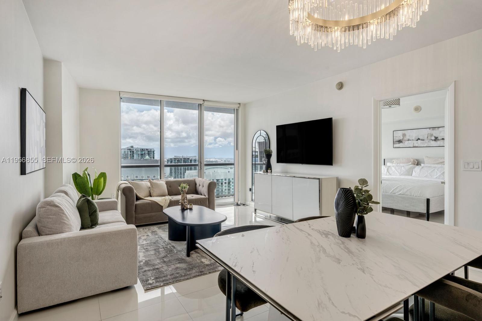 In the heart of Brickell’s waterfront district, steps from Brickell City Centre and Mary Brickell Village. ICON Brickell Tower 3 is a Philippe Starck-designed, full-service condo-hotel on the Biscayne Bay/Miami River with resort-style amenities including a 300-ft pool, spa & 28,000 SF fitness center. Ideal as a primary residence, second home, or flexible income property with short-term rental options. Residence 4706 is a high-floor 1 bed/1 bath with 842 SF, open living/dining, glossy tile floors, and floor-to-ceiling glass opening to a private balcony with sweeping skyline views. Modern kitchen with stainless appliances and warm wood cabinetry. Spa-style bath with double vanity and tub/shower, plus in-unit washer/dryer. Valet parking only.