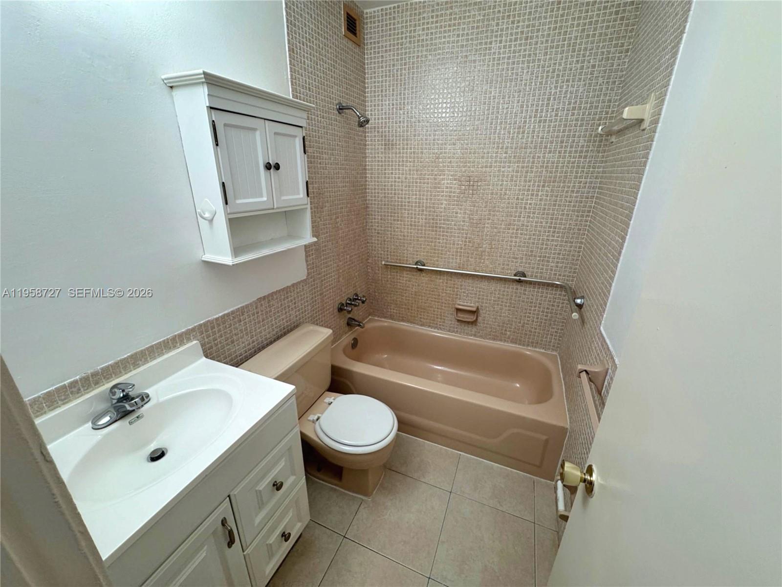 Well-appointed guest bedroom at 2060 48th Ter - Condo in Lauderhill