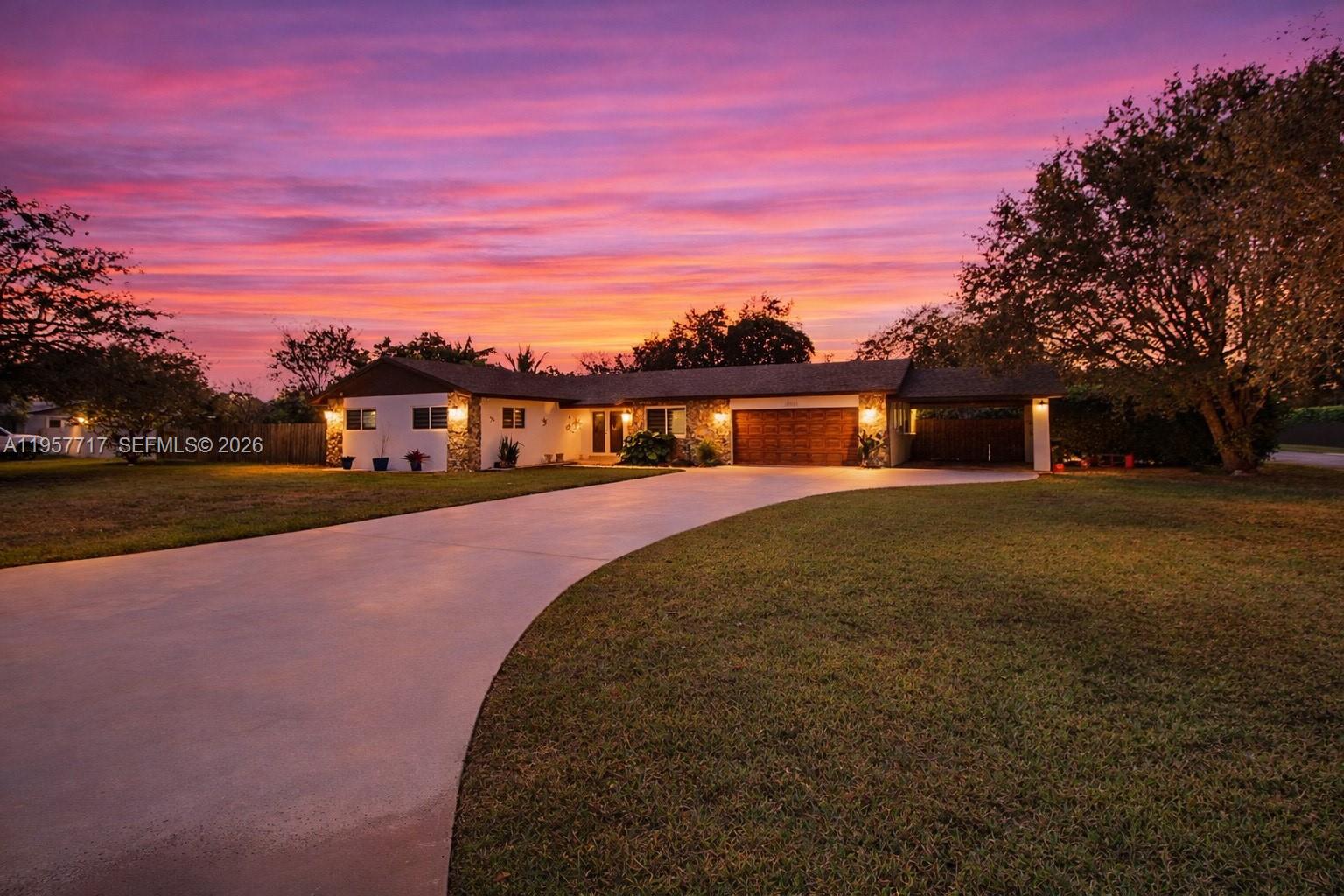 Modern comfort meets country charm in this beautiful Redland retreat! Set on a ½-acre corner lot, this 3-bedroom, 2-bath home offers 1,700 sq. ft. under A/C with spacious bedrooms and marble flooring   throughout just 30 minutes from Miami.The sleek kitchen features stainless steel appliances and a stone waterfall countertop, opening to a screened terrace perfect for entertaining. Enjoy a 2-car garage, covered carport, and a climate-controlled utility room ideal for a guest space or office, plus a whole-house water filtration system.The expansive yard offers room for a pool, boat, RV, or garden, and even includes a chicken coop. No HOA.Schedule your private showing today and experience the best of modern living with country charm.