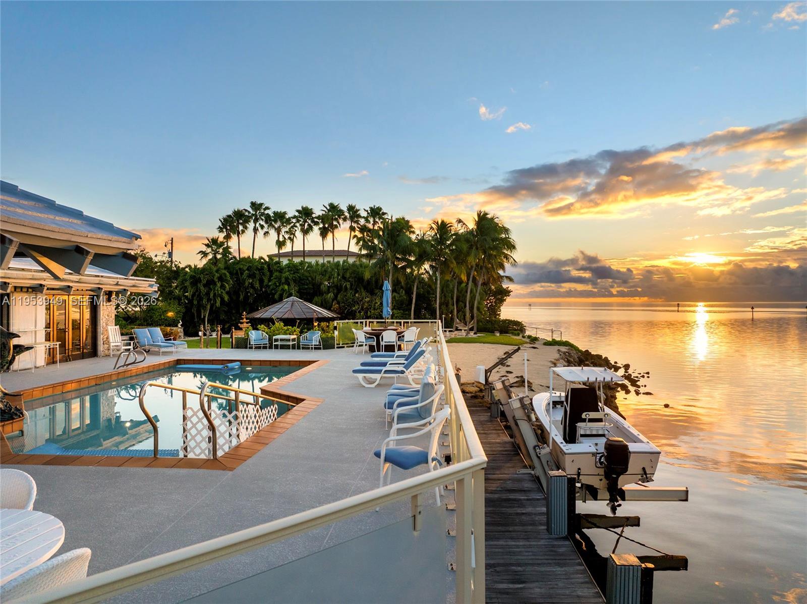 “My Paradise” earns its name! This 5BR/5BA estate sits on a 32,025 SF lot with 250’ of unobstructed pristine waterfront views on both sides, capturing mesmerizing sunrise-to-sunset across Biscayne Bay, Downtown, Miami Beach & Key Biscayne. Privately positioned at Lugo Avenue’s dead end, resort-style grounds feature lush landscaping, wooden & coral walkways, gazebo, sand beach, summer kitchen & serene fountains. Elevated pool deck w/glass railings frame sweeping bay & island vistas. Spacious open living room w/pitched wood-beam ceilings, skylights, formal dining, kitchen w/Bosch & Sub-Zero appliances. Principal suite offers amazing bayside views & spa bath. A yachtsman’s dream includes 66’ dock w/lift, boathouse & plans in progress to extend to 100’. Minutes to dining, shops, & top schools.