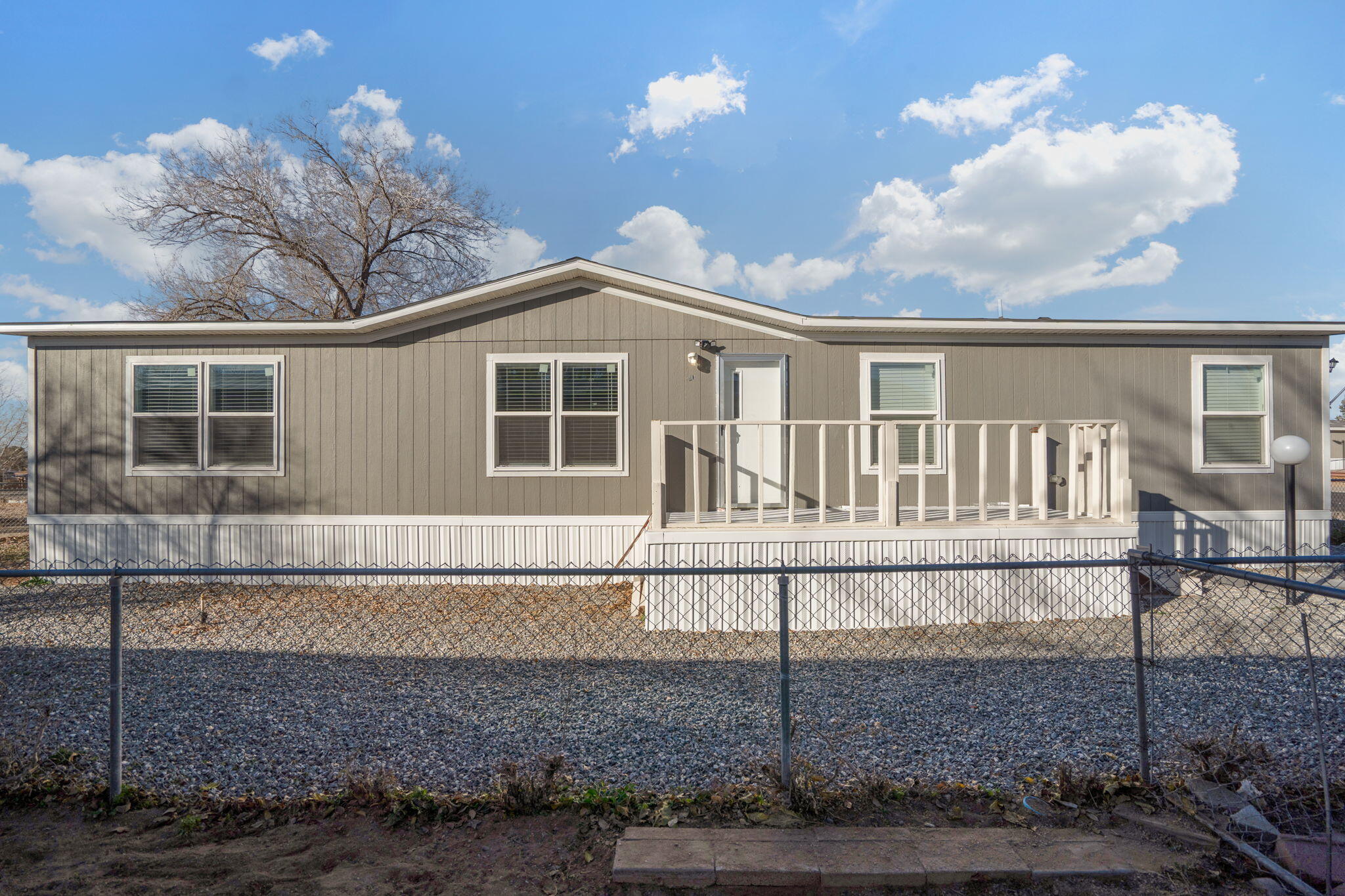 This newer 3‑bedroom, 2‑bath mobile home built in 2022, is located on a spacious and quiet lot in Coronado Village Park. The home offers a comfortable layout with well sized bedrooms and modern finishes throughout. Enjoy beautiful views of the Sandia Mountains and a convenient location close to the Balloon Fiesta Park, providing easy access to local attractions while maintaining a peaceful neighborhood setting. This well maintained home is ready for you!!