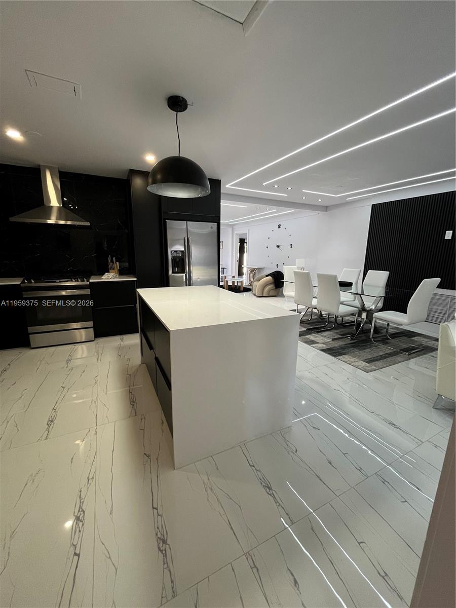Open-concept living area at 39 7th St - Home in Dania Beach