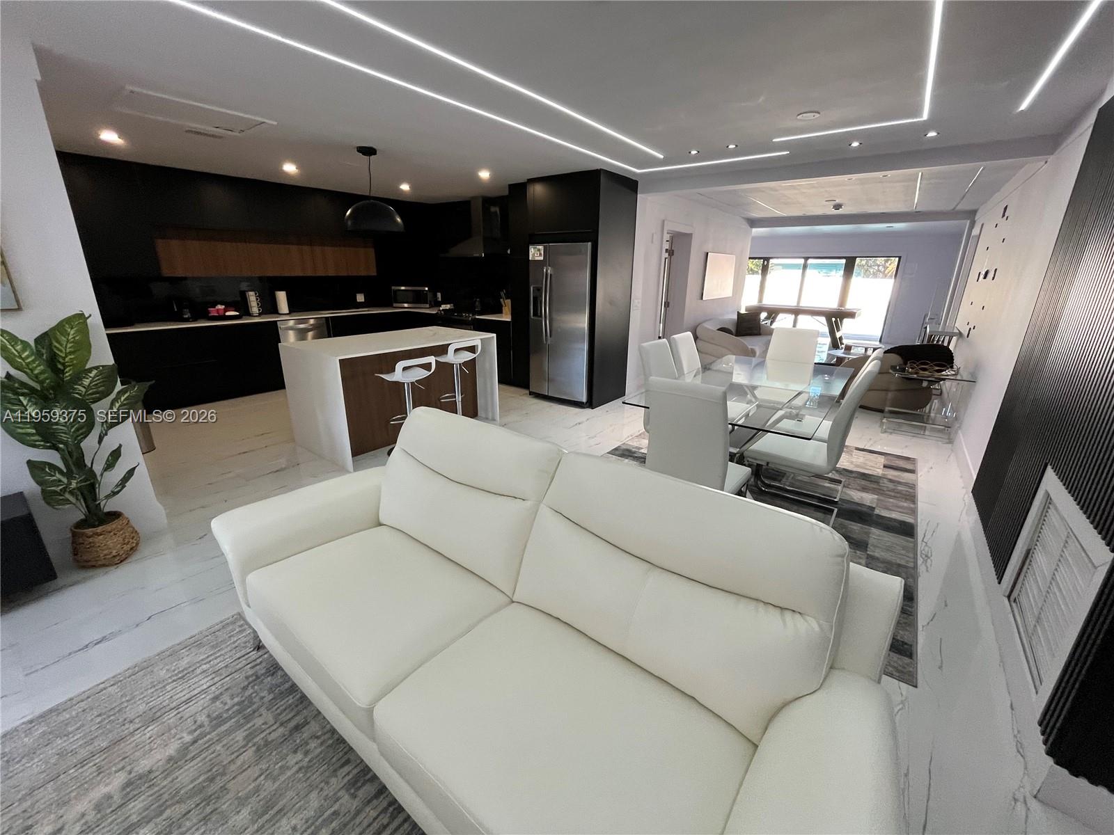 Open-concept living area at 39 7th St - Home in Dania Beach
