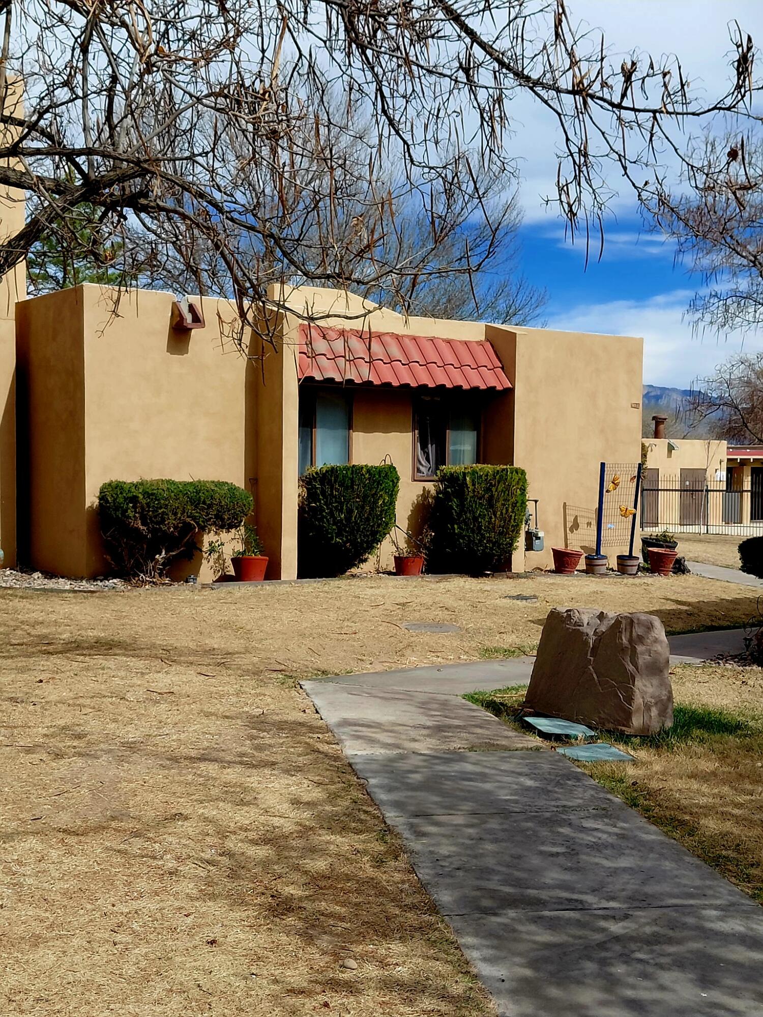 GORGEOUS 2-Bedroom, 2 Bathroom condo located within The Fairways Condominiums of Rio Rancho.  This unit is on the end of the building - ''Garden Unit'' - so no one lives above you!!  Open floor plan with living room, separate dining room and kitchen.  Many upgrades in the kitchen and bathrooms.  Back patio has been enclosed making a lovely and inviting sunroom.  Refrigerated air and assigned covered carport space.  This unit is located just yards from the swimming pool!!  Don't miss out on owning one of the few Garden Units in this community and this unit is in a prime location!!