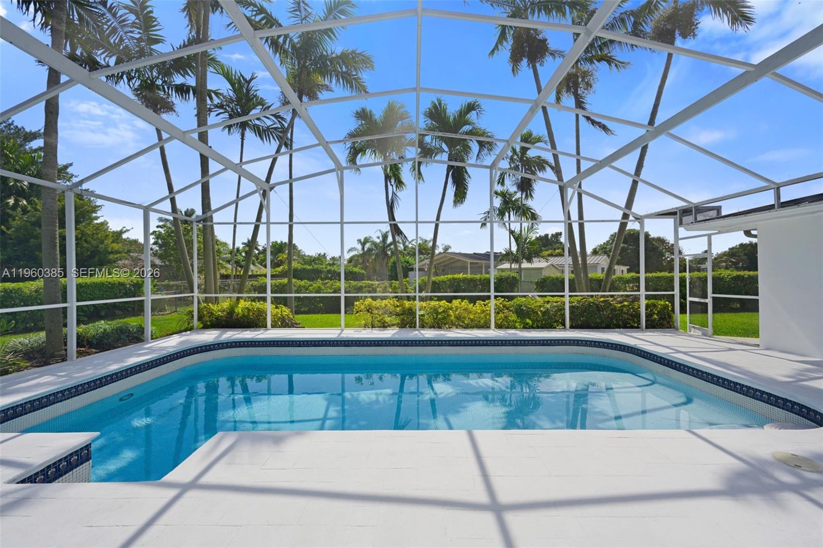 This elegantly remodeled 5-bed, 3-bath pool home offers a seamless open layout filled with natural light, impact windows, and refined finishes. The designer kitchen features quartz counters, stainless steel appliances, and a walk-in pantry. Spacious bedrooms include a private guest suite and a luxurious primary retreat with French doors, spa-style bath, and walk-in closet. Enjoy Florida living with a screened patio, resort-style pool, outdoor dining area, and lush landscaping on an 18,018 SF lot. Metal roof, circular driveway, 2-car garage, and extra storage. Move-in ready and NO HOA! Located in one of Palmetto Bay’s most desirable neighborhoods near top schools, parks, and shopping. A timeless home offering elegance, comfort, and unmatched lifestyle!