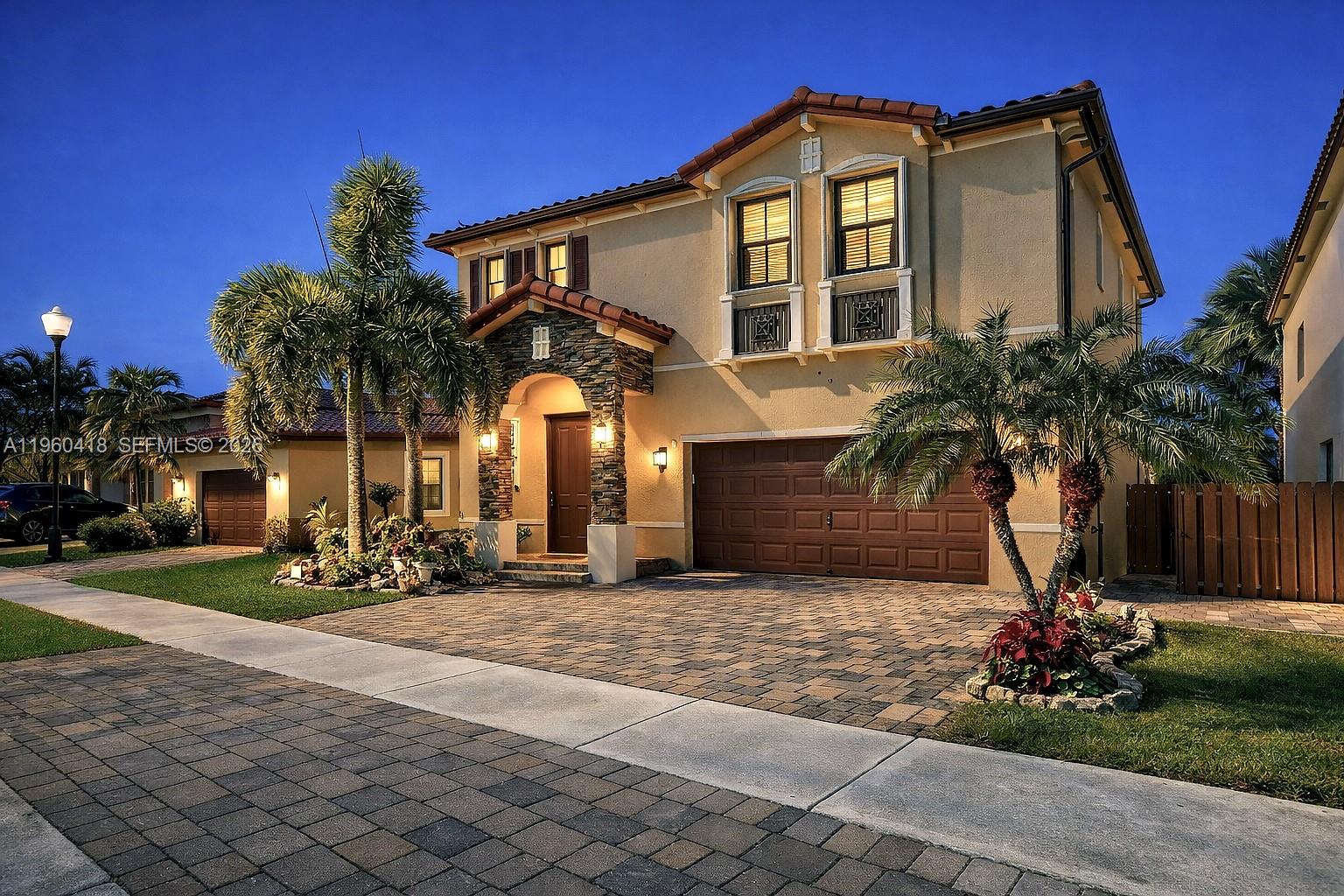 LUXURY Two-Story LAKEFRONT Residence. Experience refined living in this exquisite Two-Story home with unobstructed marvelous LAKE VIEWS. Designed for both, elegance and comfort, the residence features a GRAND TERRACE ideal for entertaining, a TWO CAR GARAGE, and a sleek tile flooring throughout. The interior offers a generously sized GOURMET KITCHEN, formal living and dining rooms, and a spacious family room, all filled with natural light. The oversized master bedroom includes a spacious master bathroom with breathtaking lake views, creating a peaceful private retreat. This community offers  exclusive amenities and services: Fully equipped FITNESS CENTER, sauna, resort style swimming POOL and JACUZZI, weekly lawn care, annual professional tree trimming. Monthly pest control, biweekly bulk and yard waste collection. Ideally situated near top supermarkets, Baptist Hospital, Medical Centers, fine dining options, two shopping malls, pharmacy stores and EASY ACCESS TO TURNPIKE and Main Roads. A rare opportunity to own a sophisticated lakefront home offering luxury, convenience, and an exceptional lifestyle.