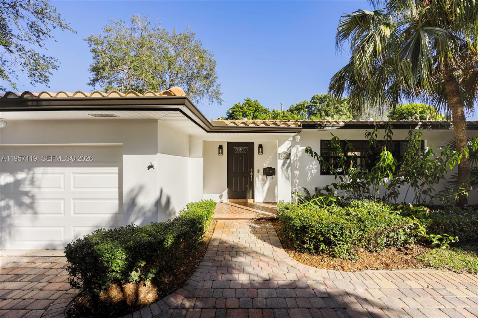 This inviting 3-bedroom, 2-bath residence offers the coveted Coral Gables trifecta: a spacious lot, pool/spa, and two-car garage. Just beyond the foyer, the light-filled living room opens to serene views of the pool, while the split floor plan provides a functional layout for everyday living. Recently painted inside and out, the well-maintained home showcases original terrazzo and Saltillo floors that add warmth and timeless character. Outdoor living is enhanced by a covered patio, ideal for relaxing or entertaining. Set deep on the lot, updated landscaping offers added privacy. Located within walking distance to the University of Miami and close to places of worship, shopping, dining, and all that Coral Gables has to offer.