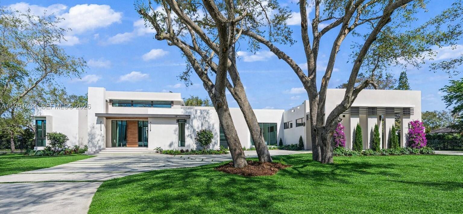 Brand new one-story corner modern masterpiece on an acre of land, over 8,660 SF surrounded by mature oak trees on scenic Old Cutler Road in North Palmetto Bay.  This one-of-a-kind estate includes TOP OF THE LINE finishes and smart home technology.  A total of 6 bedrooms with en-suit baths and 2 powder rooms; the layout includes a bedroom wing with 4 bedrooms and laundry and a guest wing with 2 bedrooms. For car aficionados, the expansive garage is designed with space for car lifts, plus a car port, enough room for 5 cars.  Enjoy a huge great room offering seamless indoor-outdoor living with volume ceilings, a floor to ceiling wine cellar display and full bar.  The Italian Pedini gourmet kitchen comes equipped with Wolf and Subzero appliances, and a hidden butler’s pantry. The family room, ideal for entertainment, is adjacent to a huge outdoor summer kitchen.  The expansive covered terrace boasts over 1,680 SF and the yard comes with an oversized pool and jacuzzi.  Surrounded by top schools, you won’t find another custom-built entertainer’s paradise like this in all of Miami.For you tube video click on virtual tour.