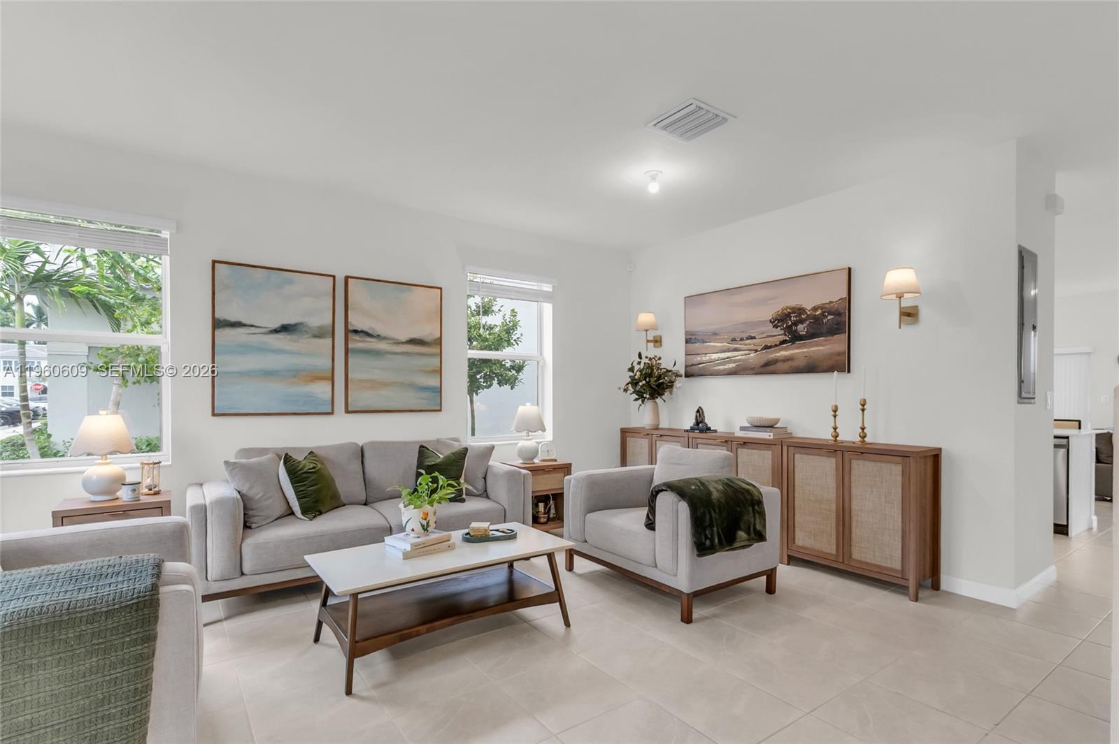 4.5% ASSUMABLE INTEREST RATE! This is a must-see home with a low rate that could save you hundreds monthly! This stunning corner unit offers ultimate privacy with NO BACK NEIGHBOR! Enjoy modern villa living with beautifully designed space. The open concept layout is perfect for entertaining, featuring natural light, high ceilings, and a kitchen with serene views to your private backyard. This is the best layout for your money! The split floor plan upstairs provides maximum privacy for the primary suite. Move-in ready and in pristine condition throughout. The play area steps away from your backyard. Security alarm system included. Near Homestead Air Reserve Base, shopping centers and easy access to US1.