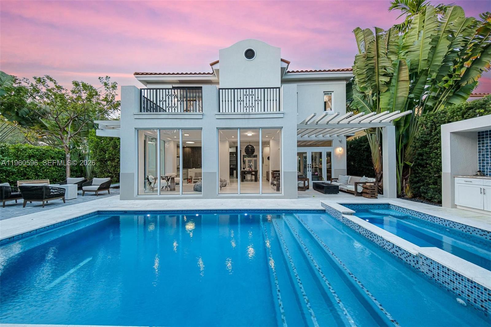 Welcome to 722 Navarre Ave. Striking 2021-built modern residence located on a quiet, tree-lined street in prime Coral Gables, just minutes from Miracle Mile. This thoughtfully designed 4 BD / 4 BA home features soaring ceilings, abundant natural light, and a seamless open-concept layout ideal for both living and entertaining. The chef’s kitchen is outfitted with Sub-Zero & Wolf appliances, custom cabinetry, a walk-in pantry. Floor-to-ceiling glass doors open to a private backyard oasis with a resort-style pool and spa, covered terrace, and summer kitchen, creating effortless indoor-outdoor living. Conveniently located near world-class dining, luxury shopping, parks, golf, and top-rated schools, offering the perfect balance of modern luxury, privacy, and walkability in the heart of Coral Gables.