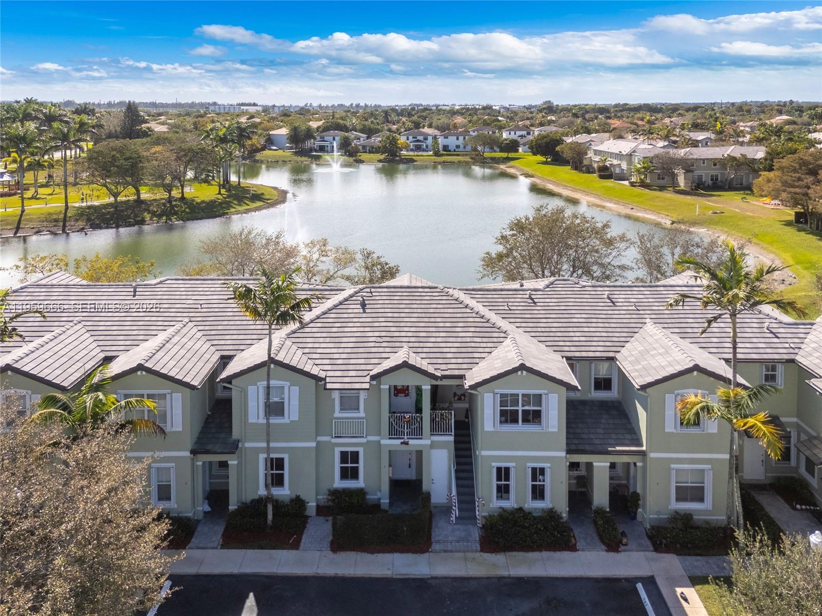 Exceptional 3/2 Lake Front Ground Floor Unit by the Main Entrance Across from the Clubhouse. Tiled Throughout. Upgraded Kitchen Cabinets w/ Granite Counter Tops & Backsplash. Bedrooms w/Tray Ceilings & Plantation Shutters.  Nice Paver Yard with Long Lake Views and Storage. Parking in front of unit.  Enjoy resort-style amenities with an Olympic-sized pool, clubhouse, gym, and walking trails. Conveniently located just minutes from the Florida Turnpike, Homestead Air Reserve Base, Baptist Hospital, Target, Publix, and Chick-fil-A.