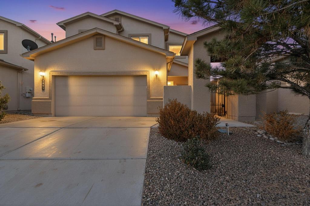 Welcome home to the clean, bright, two story house. Enter through the front gate to find a private courtyard. Inside you'll find updated kitchen & baths, tile , luxury vinyl & carpet floors & tall ceilings. The primary bedroom and bathroom are on the bottom floor, and upstairs you'll find the other bedrooms with a loft space to hanging out. You can even see the mountains from some of the bedroom windows! In the backyard, you'll find a covered patio, synthetic lawn, and is fully landscaped. USB outlets have been added, and there is AC for those warm summer months. Come check out this home in the Taos at the Trails subdivision!