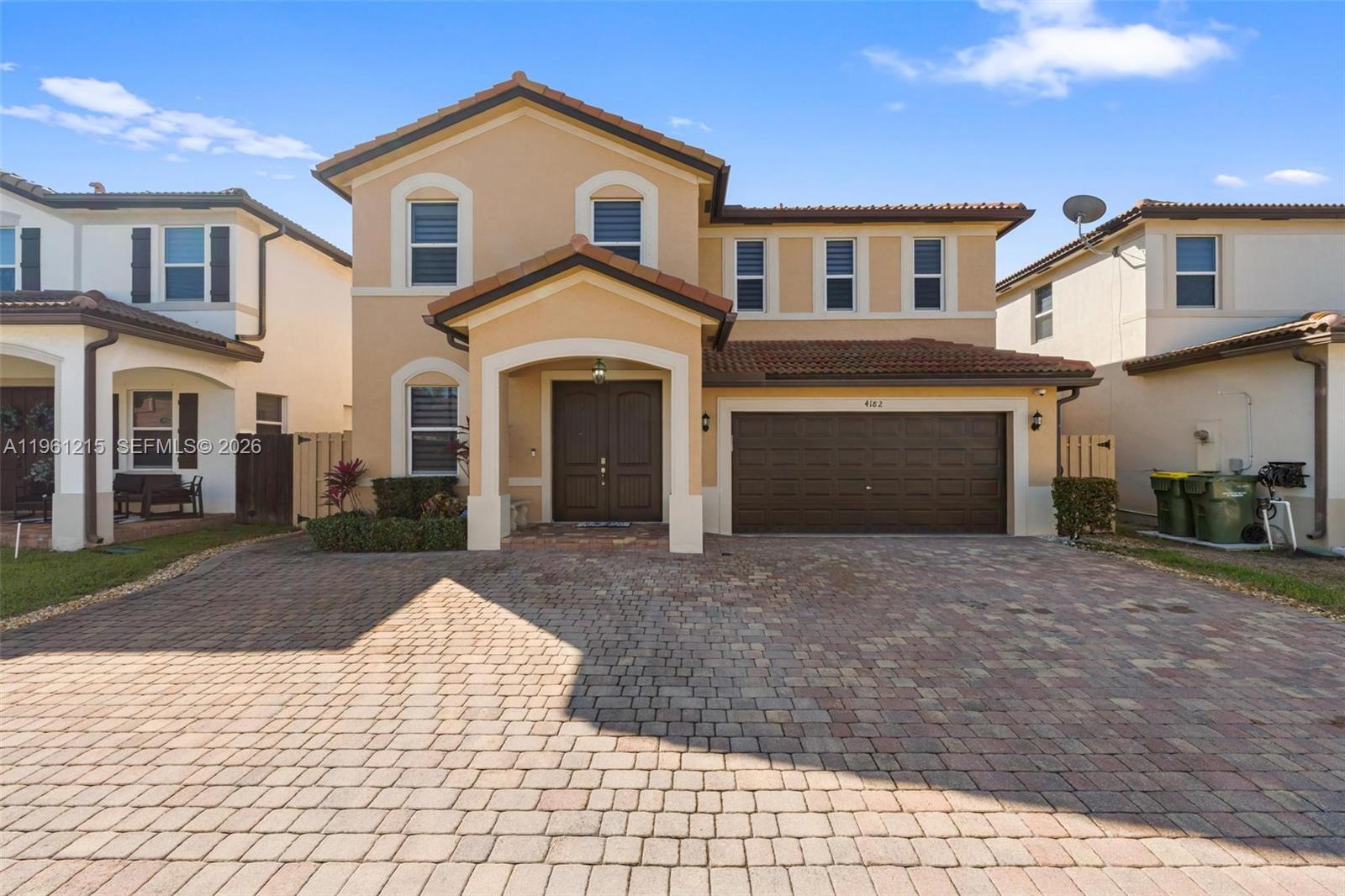 Welcome to a home designed for large families who value space, comfort, and togetherness. Built in 2018, this beautiful residence stands out for its generous layout, functional flow, and warm, inviting atmosphere—perfect for creating lasting family memories. Featuring 6 bedrooms and 4 bathrooms, the home offers plenty of room for everyone to enjoy their own space while staying connected through bright, open living areas.The property offers ample parking for up to 8 vehicles, along with additional visitor parking within the community, making it ideal for large households and gatherings. The extended paver driveway and fully paved backyard provide the perfect setting for family celebrations and outdoor enjoyment.Inside, the home blends style and practicality with nearly new stainless steel appliances, LED lighting throughout, ceramic tile flooring on the first level, and water-resistant laminate flooring on the second floor. Comfort is enhanced with crown molding, modern finishes, zebra blinds, and motorized blackout shades in the bedrooms and on the patio sliding door.Additional features include a security camera system with Ring, hurricane shutters, and a two-car garage with upgraded flooring. Located in a private, well-maintained community with low HOA, just minutes from US-1, the Turnpike, Baptist Hospital, and major shopping—all within three minutes.A beautiful, spacious, and cozy home—ideal for a growing family seeking comfort, convenience, and quality living.