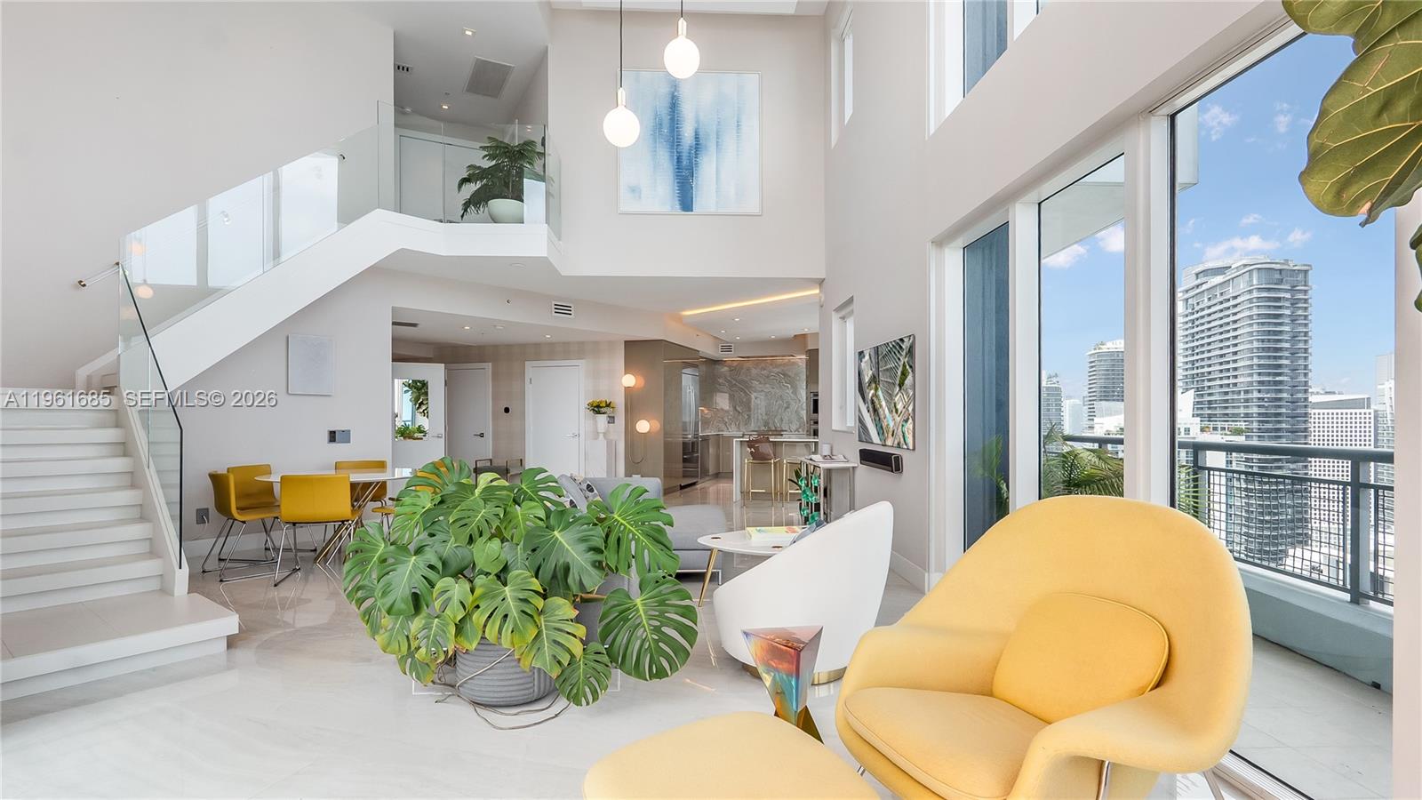 Experience sky-high living in this exquisitely remodeled 2-story duplex soaring above Brickell on the 42nd floor.Perched on the coveted SE corner, this sky villa delivers Bay, & South Brickell views through dramatic double-height glass walls that blur the boundary between indoors & sky. Reimagined with flawless modern design, it features a custom LED-lit floating staircase, designer textured walls & wallpaper, smart electronic shades, marble baths & marble-slab kitchen backsplash. Stunningly finished with upgraded automated lighting for a contemporary feel. Infinity Brickell offers resort-style living with pool, spa, fitness center, valet, 24/7 security, & exclusive rooftop access for floors 40+ — all steps from Brickell City Centre’s world-class dining, shopping, and entertainment.