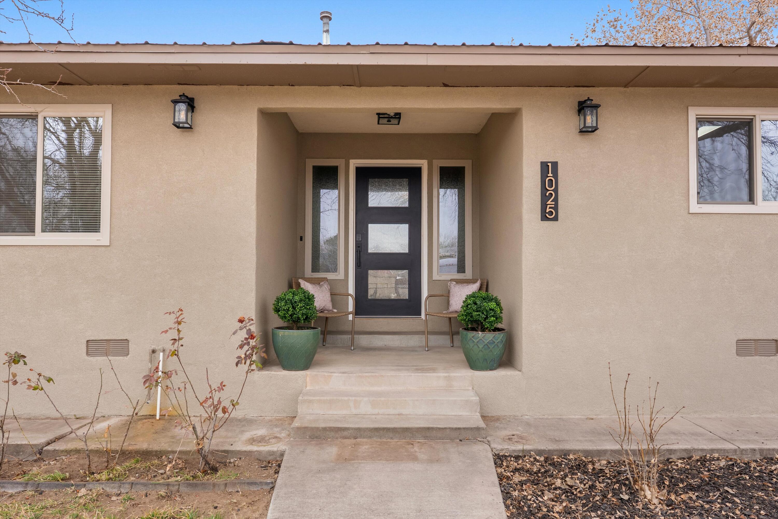 Beautifully updated 3BR/2BA home on 3/4 acre in Bosque Farms. Massive living room with high pitched ceiling; hardwood in the living room/hall and luxury vinyl in BRs. Large eat-in kitchen with concrete counters, painted cabinets, SS appliances and generous dining space; primary suite features a fully remodeled en suite (2024) with soaker tub, walk-in shower and modern black fixtures. Enjoy a west-side sun/mud room, versatile flex room off the kitchen for butler's pantry or office, and a detached 3rd garage bay perfect for a gym, studio, or shop. Conex container conveys.  New, stylish lighting throughout home for a modern touch.  All capped by new stucco and windows and gorgeous front door(2025)! Refrig. air done in 2023.  As soon as you pull into the driveway, you will know you are HOME!
