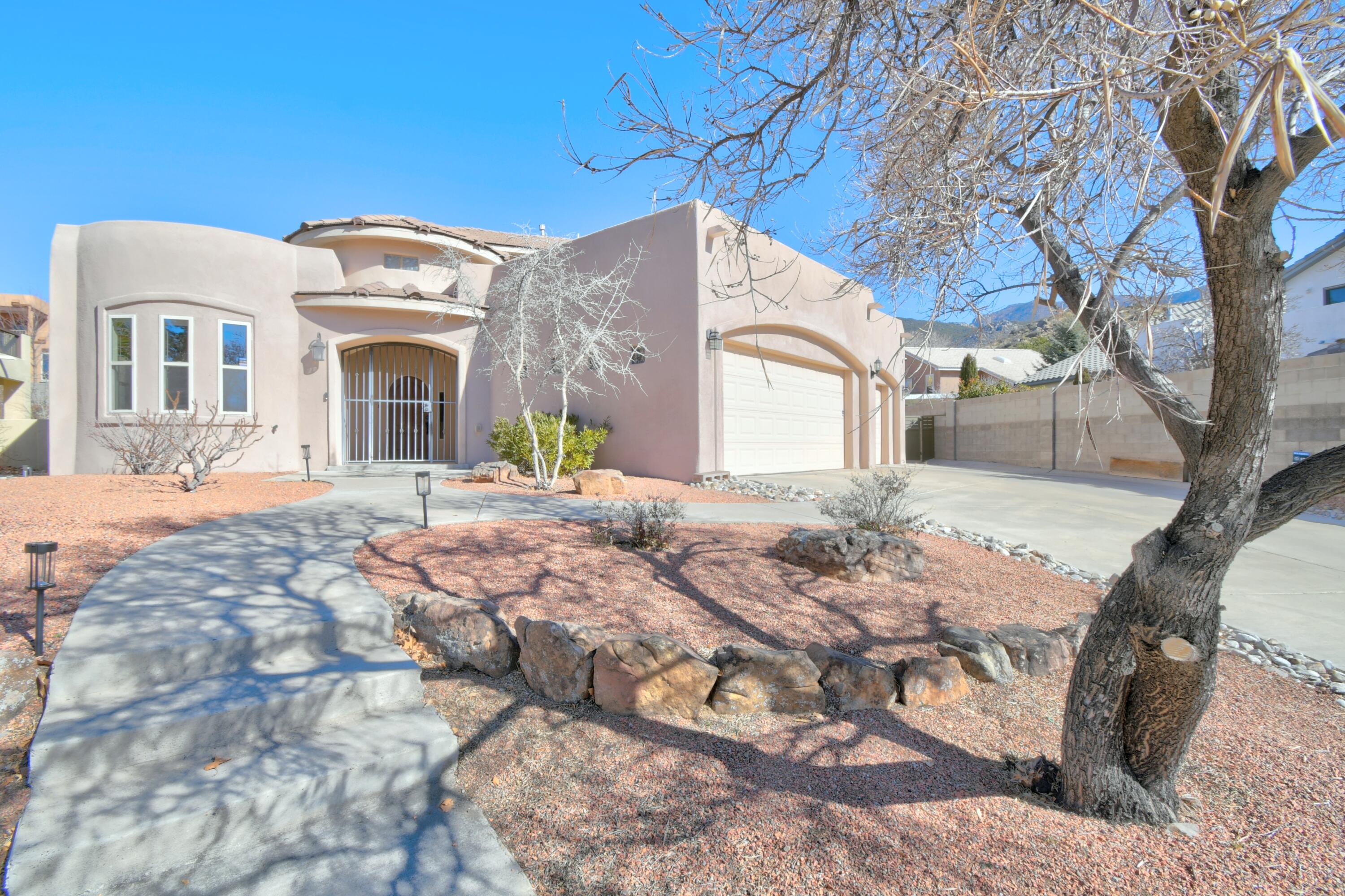 Attractive custom home in the desirable Foothills! Thoughtful design for ultimate livability, 3 bedrooms, separate office w/balcony, dining room centrally located,  plentiful storage.  Large game room (or flex space) with built-in cabinetry and wet bar.  Kitchen features island, granite counters, cherry cabinets, gas cooktop.  Tasteful architectural details in ceilings, plant ledges, lighted nichos. Quality abounds with built-in speakers, lighted stairs, solid core interior doors, laundry chute and central vacuum. Radiant heat on both levels, also two furnaces and refrigerated A/C.  Oversized 3 car garage with cabinets and storage area. Backyard access, turf, low maintenance yards,  and alcove-style back patio. Ideal location, quick access to I-40, hiking and biking trails.  See it soon!