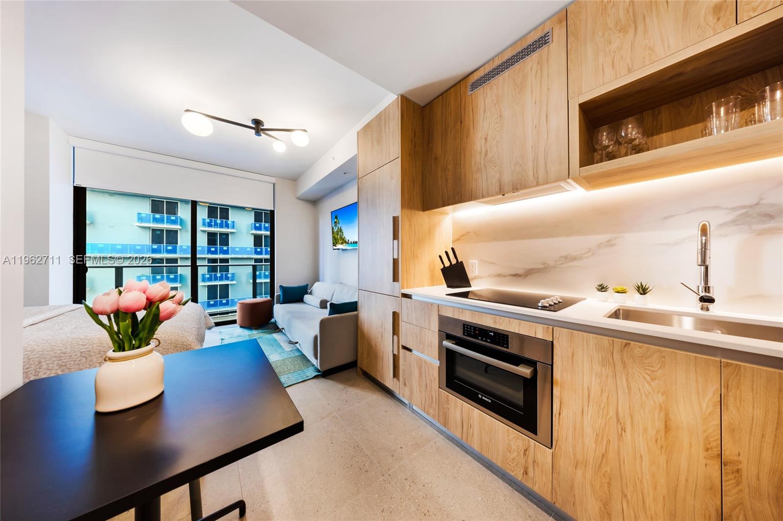 Fully furnished and equipped studio at The Crosby Miami. Turnkey and ready to generate income immediately after closing. Includes furniture, kitchenware, cutlery, towels, linens, etc. Ideal for short-term rentals or vacation home. Daily rentals are allowed in the building. Floor-to-ceiling windows and resort-style amenities featuring a rooftop pool, spa, sauna, fitness center, indoor garden, and 24/7 concierge service. Prime location just steps from kaseya Center, Brightline, world-class dining and entertainment. One of the lowest HOA fees in the area. Includes a storage unit.