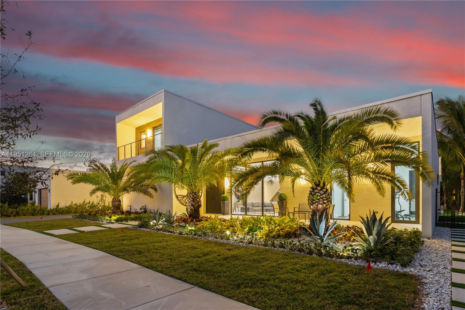 Thoughtfully enhanced with Permanent Luxury Upgrades, this refined architectural residence offers 5 bedrooms + 1 S.R. + 1 Office, 6.5 baths, and 5,293 square feet of contemporary living on a 14,381 square foot lot...Situated within the prestigious South gated enclave of Botaniko at Weston Estates, 16773 Botaniko Dr S presents a sophisticated balance of design, privacy, and seamless indoor-outdoor living...Interiors are defined by soaring ceilings, abundant natural light, and refined wood and ceramic flooring, creating a seamless flow throughout the home...A Chef-Caliber Kitchen with island, pantry, and premium appliances anchors the living spaces and connects elegantly to both formal and informal dining areas, ideal for sophisticated entertaining...An integrated wet bar, private office, service room, and a guest suite on the main level add discretion and versatility...The upper level is highlighted by a serene primary suite offering walk-in closets, dual vanities, bidet, and a spa-inspired bath designed for comfort and tranquility...Fully climate-controlled interiors with central air conditioning, electric heating, and a discreet garage laundry...Outdoors, the property unfolds as a private resort featuring a pristine in-ground pool, expansive patio, built-in barbecue and outdoor grill, architectural lighting, high-security doors, and 18 mature palm tree setting for gatherings or quiet relaxation.