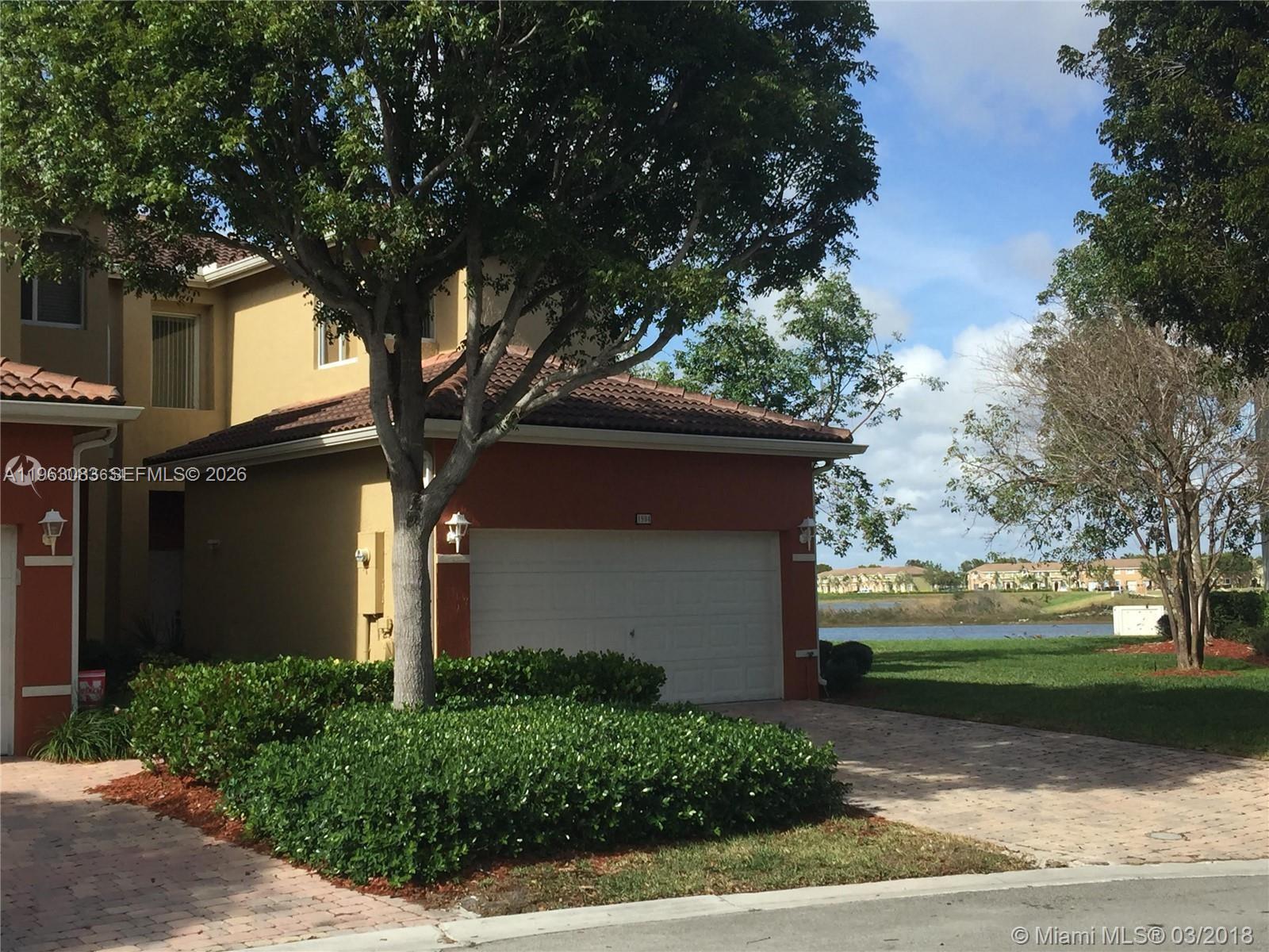 Beautiful Lakefront Corner Townhome for rent in a nice secured community across from Keys gate Golf club. Large master suite overlooking wide lake. Family and Living room also overlooking lake .Enjoy the view and relax on the balcony.All tile floors downstairs and berber carper on stairs and upstairs. 3/2.5 with 2 car garage . Separate laundry room . Partially furnished. Enjoy all amenities in this community such as pool gym playground etc. No pets please