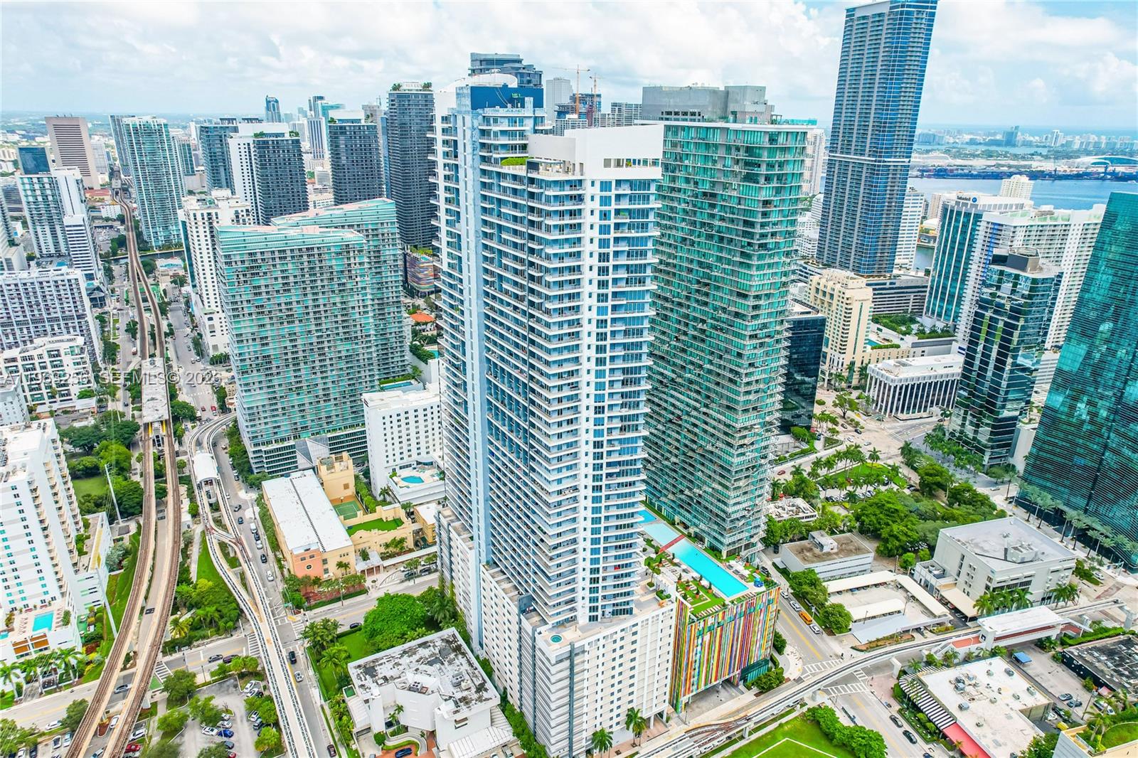 Welcome to this stunning fully furnished loft-style apartment at Infinity Brickell, featuring breathtaking panoramic views of the Atlantic Ocean and the Miami skyline. This spacious residence offers the largest layout for a 1-bedroom, 1.5-bath unit in Infinity and can be rented for 30 days or longer.Nearly 93 m² (about 1,000 SF) loft with white porcelain floors throughout, a light-wood kitchen with stainless-steel appliances, and granite countertops. Both levels feature 10-foot ceilings.Enjoy abundant natural light, stainless-steel appliances, and luxurious granite finishes. Full amenities include a pool, gym, spa, valet parking, 24-hour concierge service, and much more—just steps from shops, restaurants, and everything Brickell has to offer.
