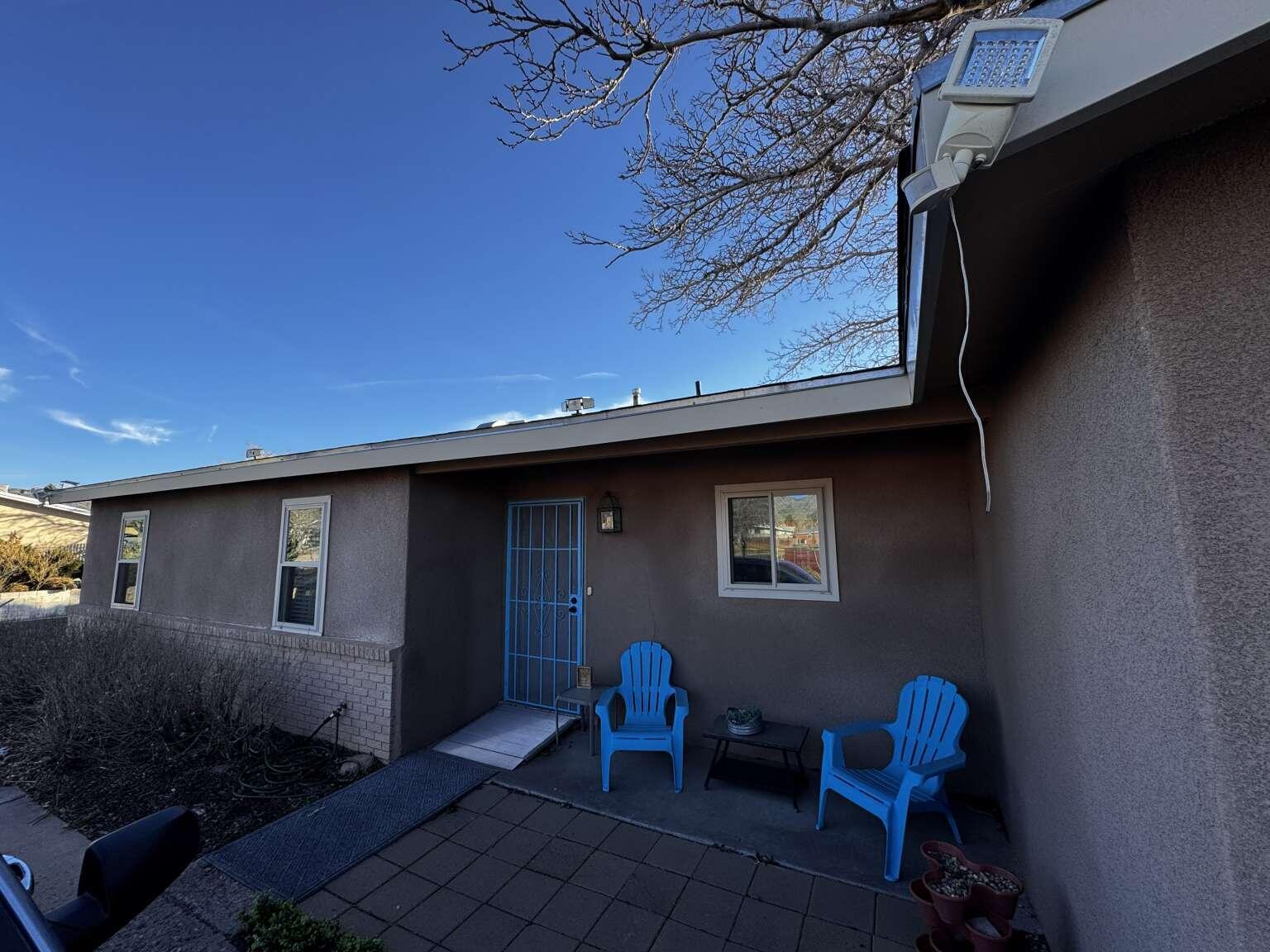 Discover this well-maintained 3-bedroom home in the Northeast Heights, featuring a versatile home office and no HOA. This residence offers significant recent upgrades, including a 3-year-old roof, newer windows, and a recently serviced cooling system. Enjoy a unique outdoor space with a breezeway, artificial turf, and mature pine trees. The property is a dream for travelers, boasting dedicated RV parking equipped with electricity. Complete with central heat, 2 storage sheds, and a spacious 1,718 sq ft layout, this home is ready for your personal touch.