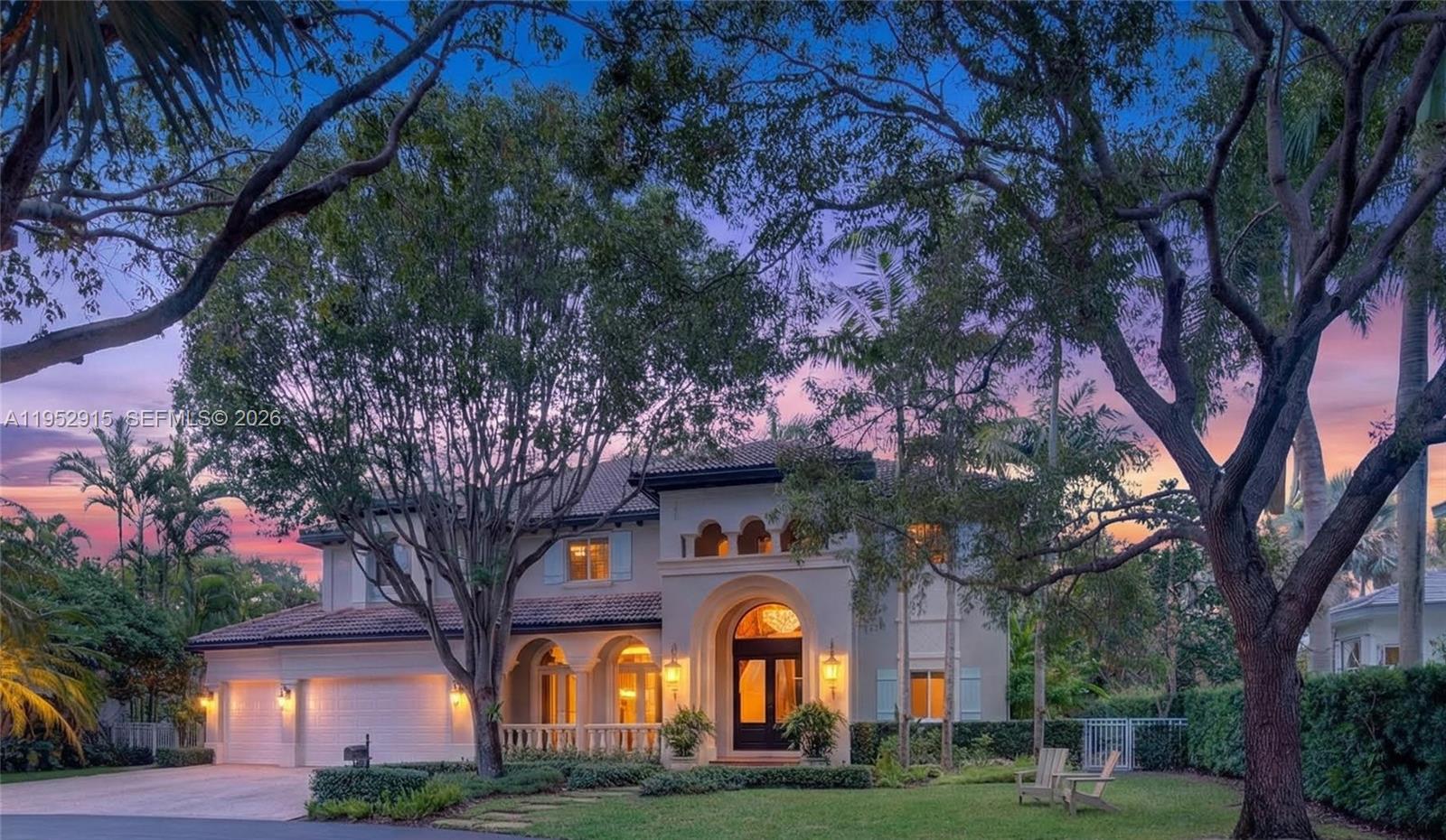 From the moment you enter this gated community, life begins to slow down. Tucked away on a quiet cul-de-sac, this home offers rare privacy, peace of mind, and the feeling of a true luxury retreat—where children can safely play freely outdoors.Out back is where the lifestyle truly unfolds. Designed as a private sanctuary, the backyard features a resort-style pool, a full outdoor kitchen, and thoughtfully planned green spaces that invite a connection to nature. A charming cottage is nestled among the greenery, creating a setting that feels peaceful, intentional, and deeply grounding.Inside, light-filled living spaces flow seamlessly through the living room, formal dining area, and chef’s kitchen. The kitchen is accompanied by a gas Wolf range, Sub-Zero refrigerator, and electric double wall ovens. Extensive custom millwork throughout the kitchen, family room, and library adds craftsmanship and architectural character. A dedicated wine room enhances the home’s refined yet relaxed lifestyle.Custom lighting and chandeliers elevate each space. A three-car garage—with one bay converted into a home gym offers flexibility for modern living. Impact windows and a whole-home generator provide comfort and peace of mind.This home offers a coveted suburban lifestyle with walkability—just minutes to restaurants, parks, water access, and everyday conveniences. Ideally located near multiple highly acclaimed private schools and within an excellent public school district.