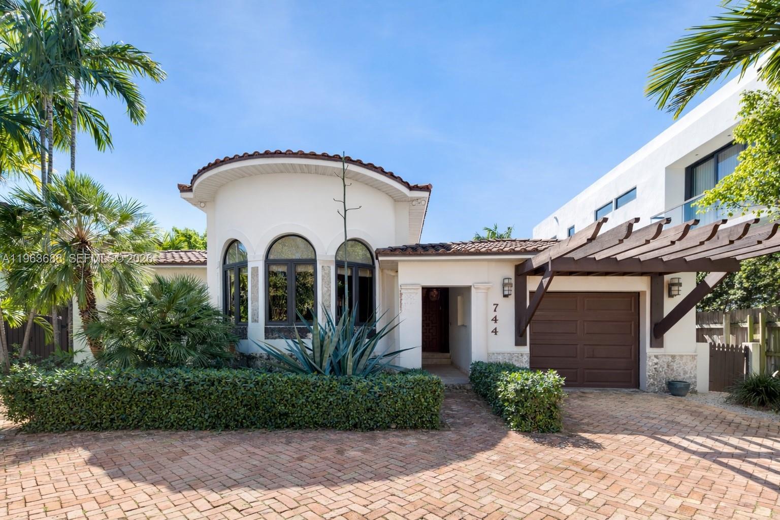 Situated on the widest stretch of Surprise Lake in the heart of Lakeview, this oversized 14,140 SF waterfront property offers expansive open water views, direct ocean access, a private dock, pool, and expansive backyard designed for boating, entertaining, and everyday outdoor living, a true boater’s paradise.The four-bedroom residence features bright interiors with strong natural light, well-proportioned bedrooms, and comfortable living spaces that open seamlessly to the water. Large windows and effortless indoor-outdoor flow create an airy, light-filled environment throughout. The primary suite overlooks the lake and features a spacious bathroom, offering a private waterfront retreat. A sunlit kitchen equipped with Wolf appliances anchors the home, opening to comfortable living and dining areas ideal for gatherings and daily family life. The layout supports effortless living today, with the ability to elevate and modernize over time to reflect your own design vision.Lakeview is one of Miami Beach’s most established and desirable neighborhoods, known for tree-lined streets, a strong sense of community, proximity to top schools and parks, and convenient access on and off the Beach. Enjoy the home as is, update to your taste, or design a custom waterfront estate that fully maximizes this exceptional lot and premier location.