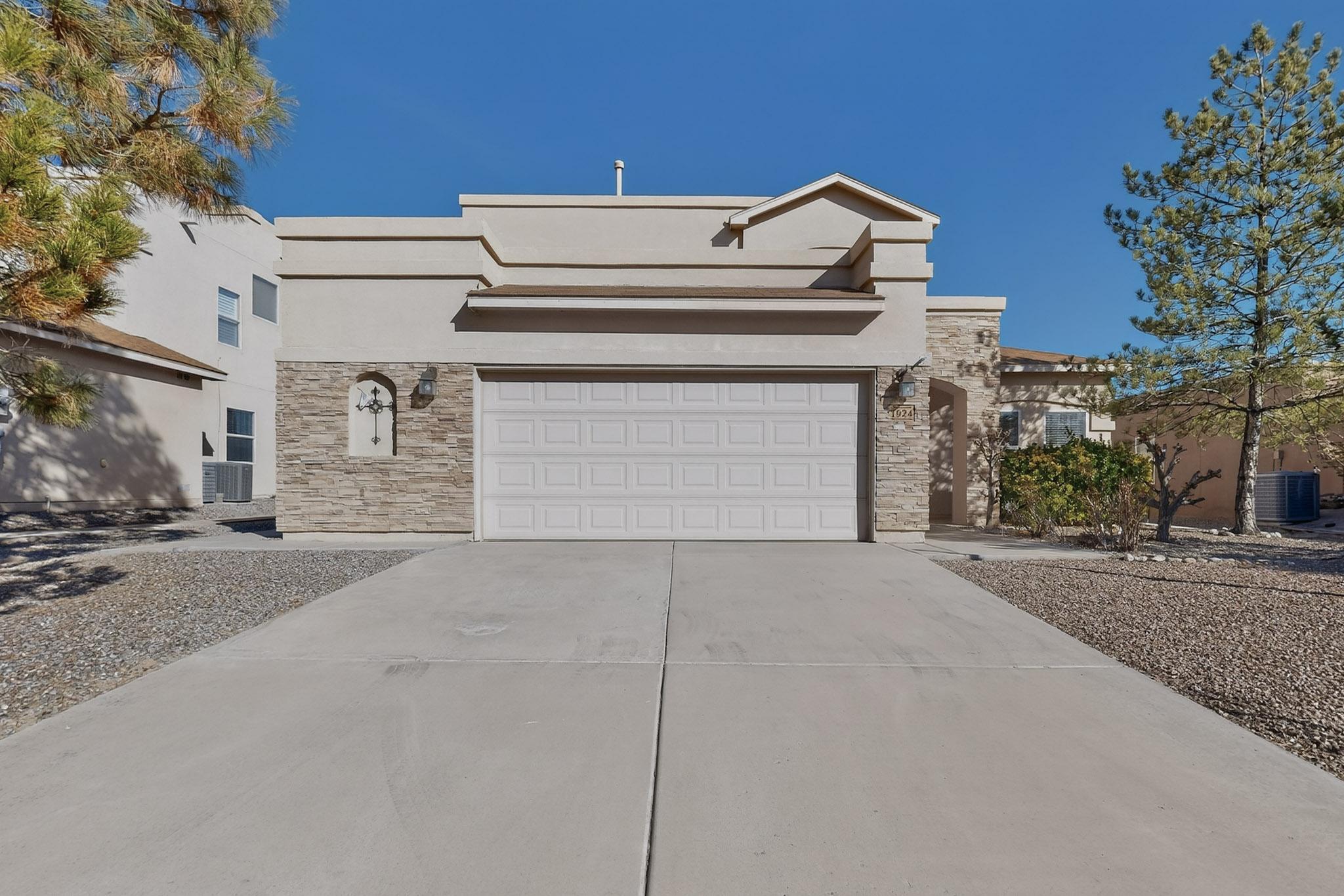 Welcome to this spacious Cabezon home in the heart of Rio Rancho. Offering 4 bedrooms, 3 bathrooms, and nearly 3,000 sq ft, this residence features an open layout with soaring ceilings and abundant natural light. The main level includes the primary suite plus a guest bedroom and nearby bath, ideal for multigenerational living. The kitchen offers ample counter space, island seating, dining area, and breakfast nook. Upstairs includes two bedrooms, loft, and mountain views from select rooms. Enjoy a covered patio with gas BBQ hookup, fruit trees in front and back, and a large side yard space. Fully owned solar conveys. Quiet, private neighborhood near parks, schools, and shopping.