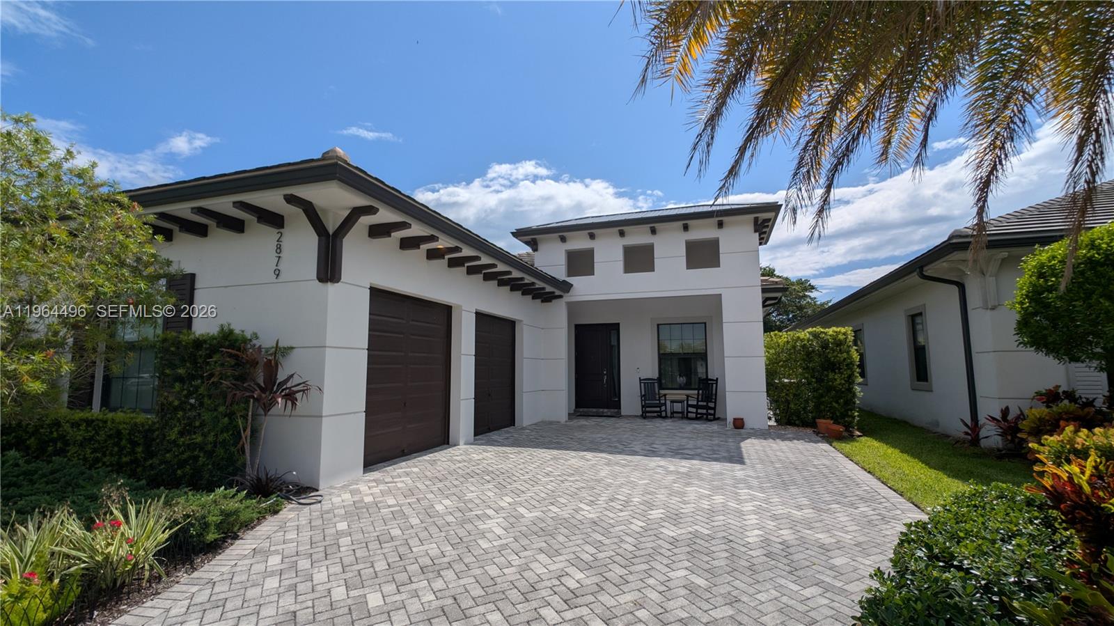 A rare opportunity within the gated Banyan Cay enclave of West Palm Beach. Built in 2020, this 3BR/3BA custom residence offers refined design, soaring ceilings, and bespoke finishes throughout. The primary suite opens directly to the private pool, creating a seamless indoor-outdoor living experience designed for both relaxation and entertaining. A tranquil backyard with pool & spa enhances the home’s private resort feel. With only a limited collection of residences in the community, this property offers true exclusivity—ideal as a distinguished seasonal retreat or full-time residence. Positioned beside Dutchman’s Pipe Golf Club, a Jack Nicklaus Signature Course, and moments from premier dining, shopping, and Palm Beach’s most desirable destinations.