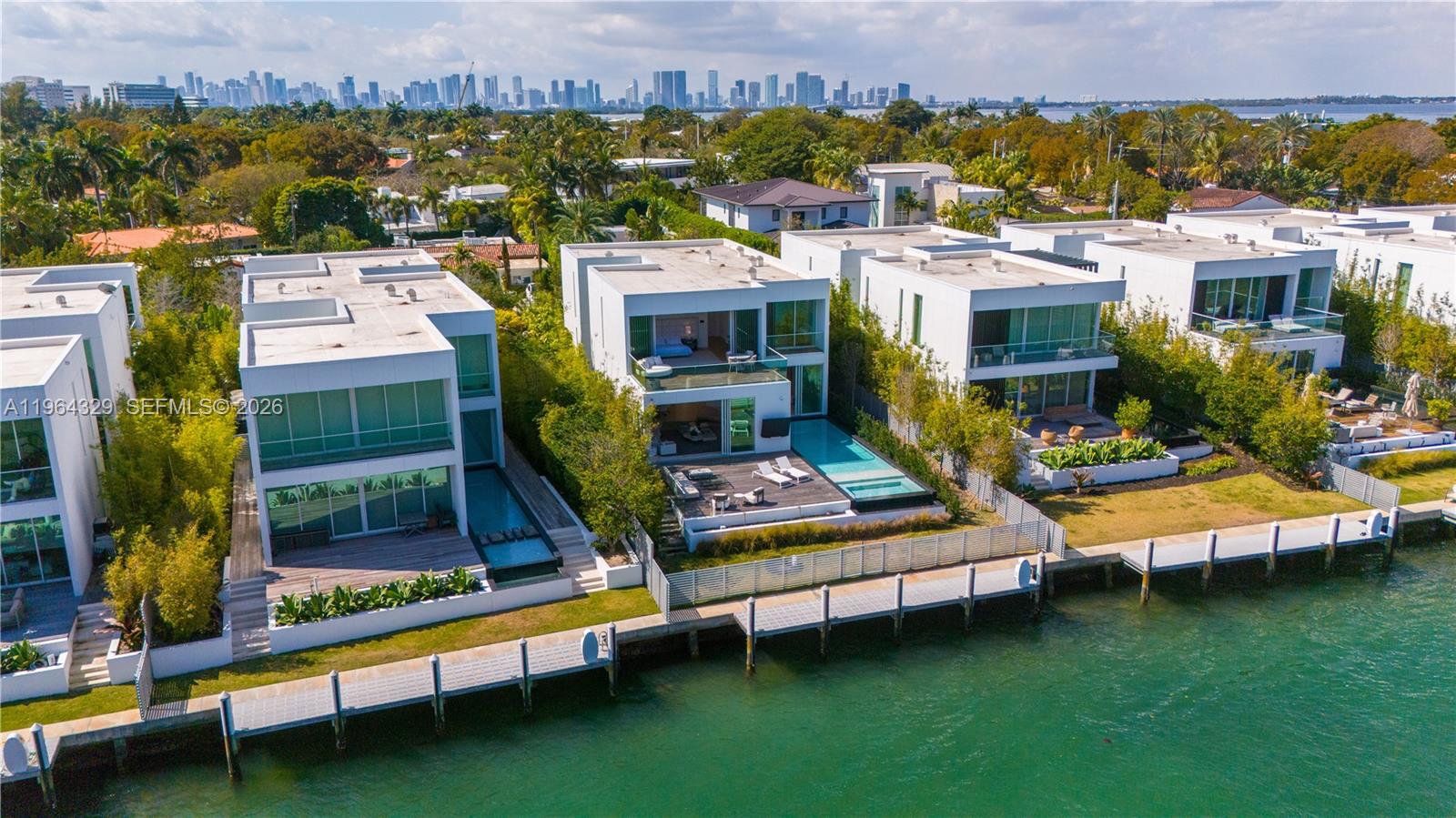 Indulge in the pinnacle of waterfront sophistication at the Ritz Carlton Villa Collection Miami Beach. This two story, private home designed by world renown architect Piero Lissoni features a spacious floor plan with brilliant distribution, soaring ceiling heights and finishes by Boffi, Gaggenau, and Fantini. This secluded enclave offers a tropical indoor/outdoor experience at every turn with floor to ceiling glass throughout, private pool oasis and multiple outdoor living spaces. Enjoy instant access to the intercostal from your private dock boasting 60' of water frontage. The property is completely gated and offers 2 garage spaces as well as 2 driveway spaces. HOA includes all exterior pool and property maintenance, hurricane and flood insurance as well as exclusive access to the main building amenities which boast resort style spa, cabana infinity edge pool, world class fitness facilities and restaurants all maintained to the brand standards synonymous with the Ritz Carlton. Additional photos of Ritz Carlton amenities available upon request.